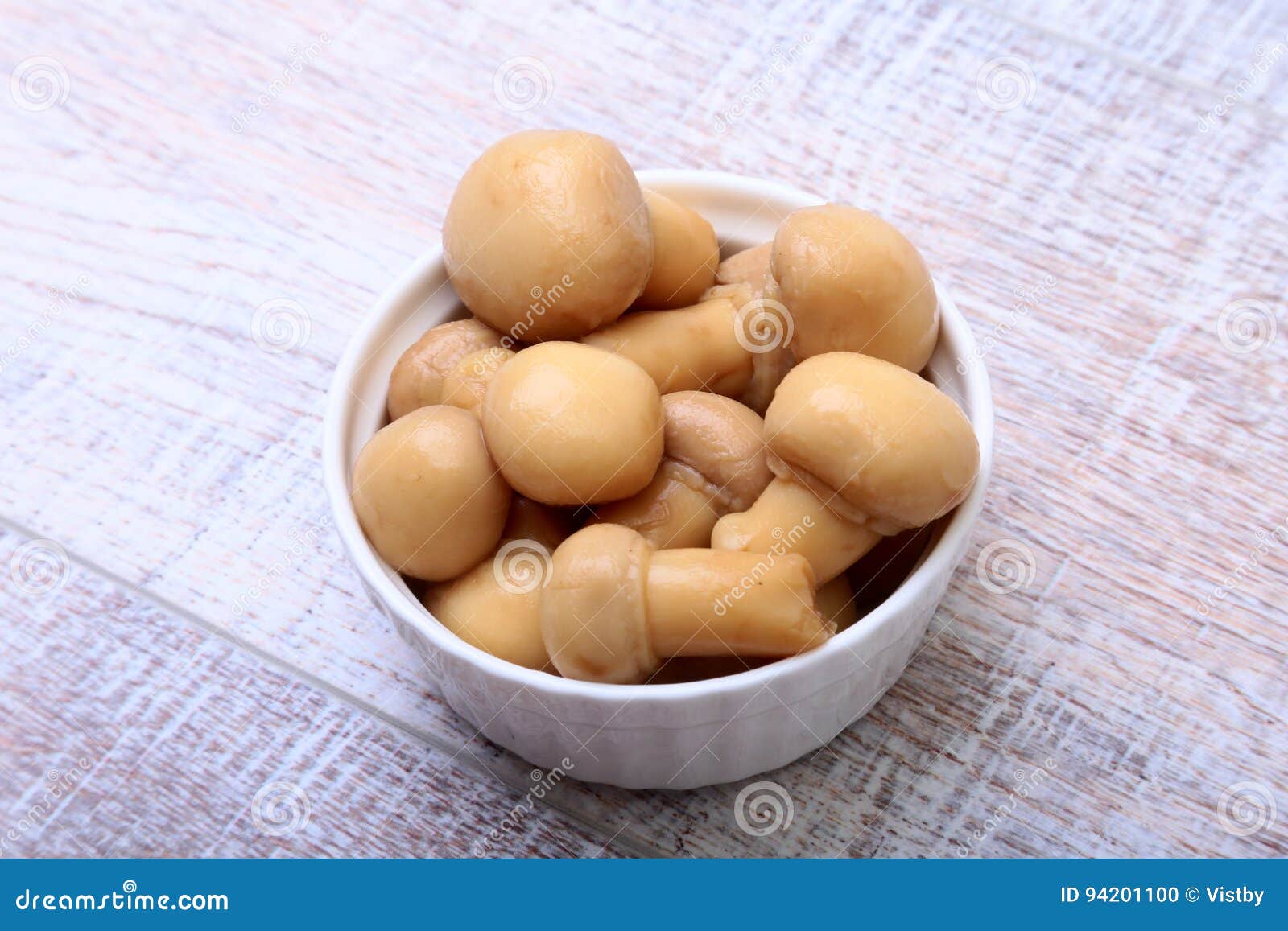 Marinated Champignons in White Bowl. Ready for Cooking. Stock Photo
