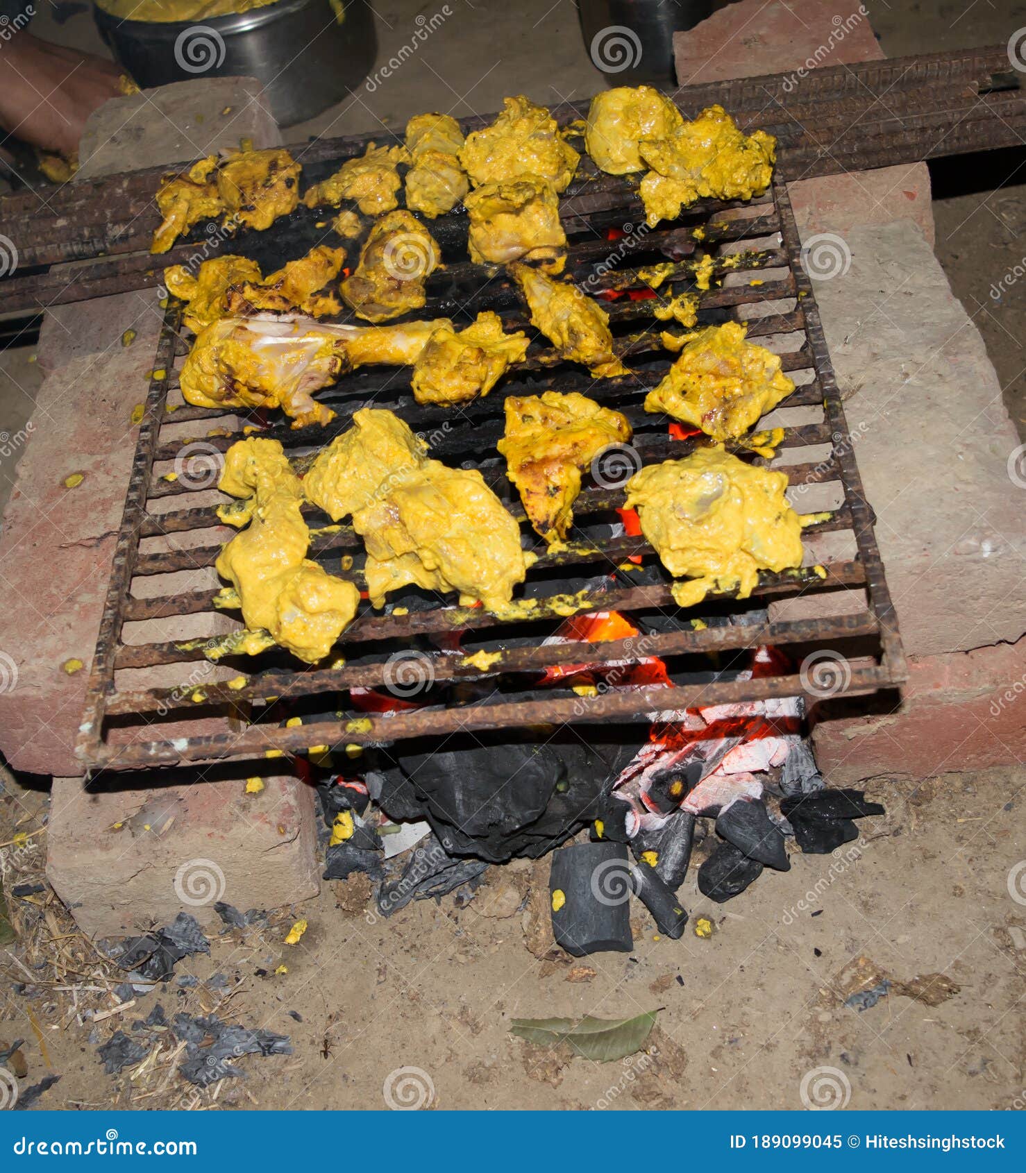 Marinated Chicken Preparing on a Barbecue Grill Over Charcoal. Chicken Meat Pieces on Grill