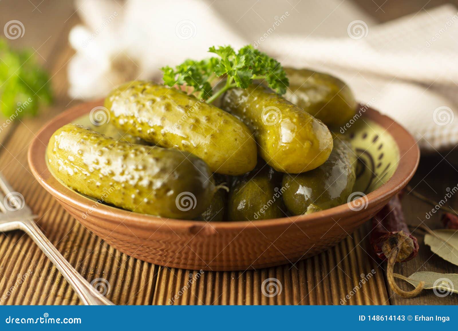 Marinated Cucumbers. Pickles Veggies in Bowl, Wooden Table Stock Image