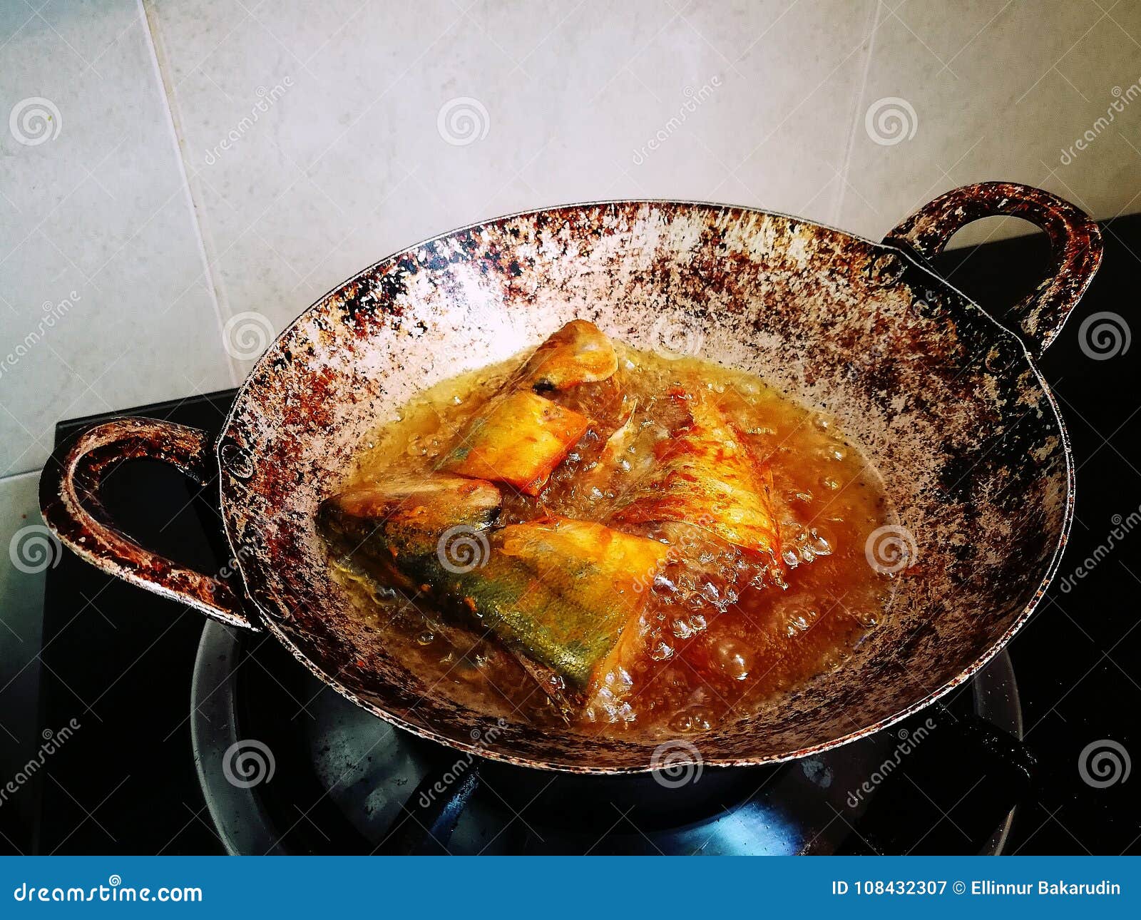 Marinated Fish with Seasoning is Fried in a Pan. Stock Image Image of