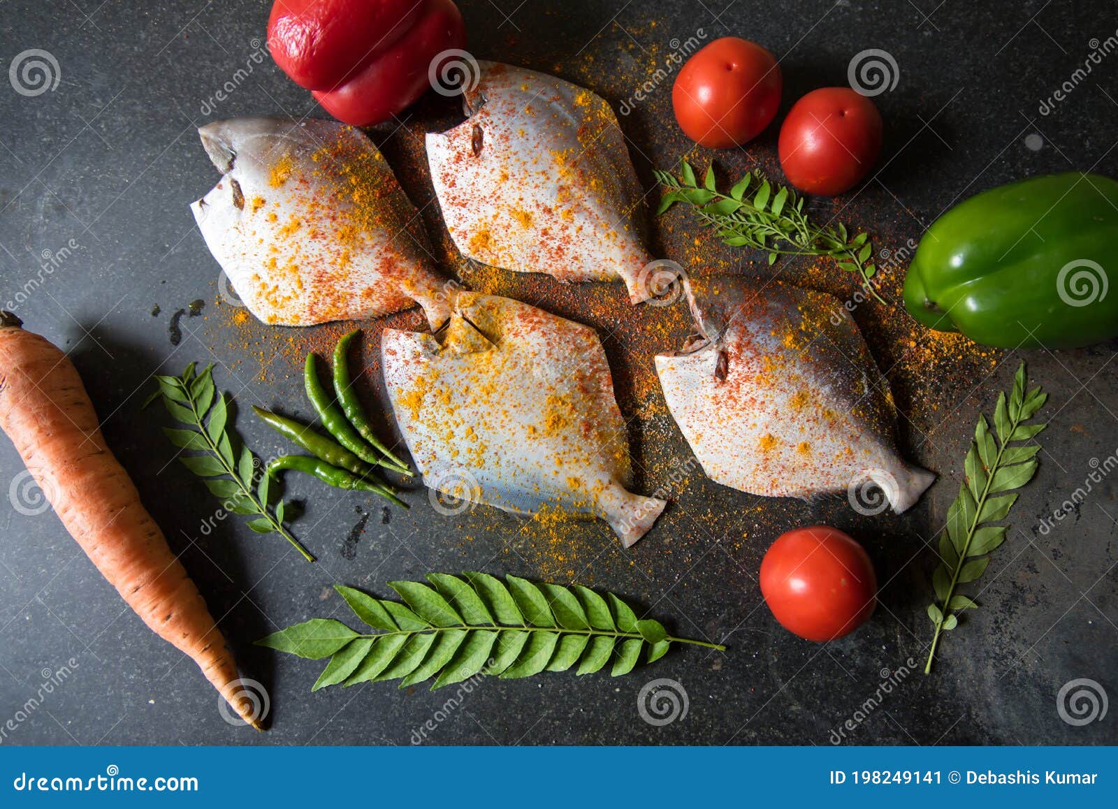 Marinated Fresh Fish With Vegetables On A Black Background. Stock Image