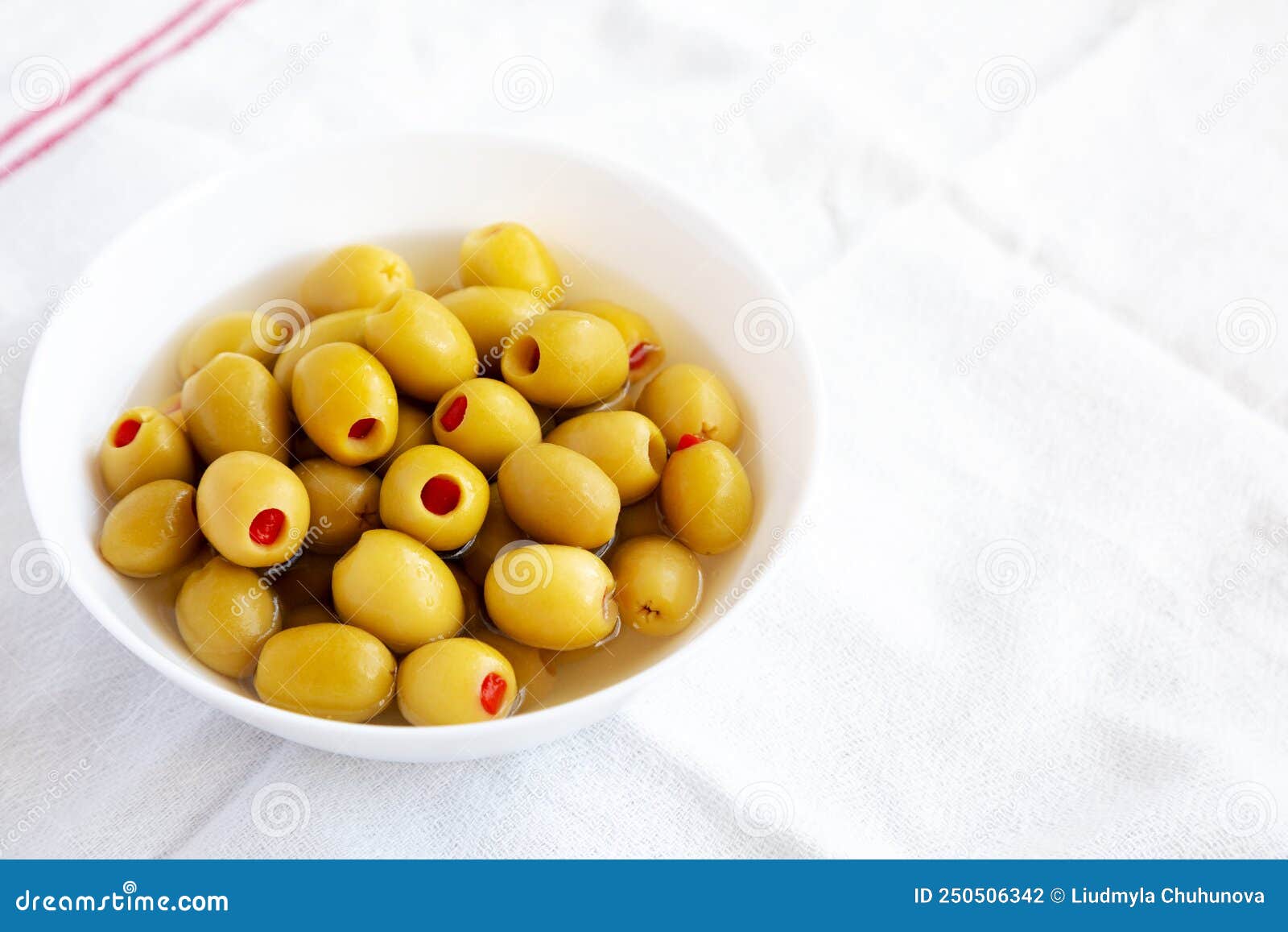 Marinated Green Olives with Pimento Peppers in a Bowl, Side View Stock