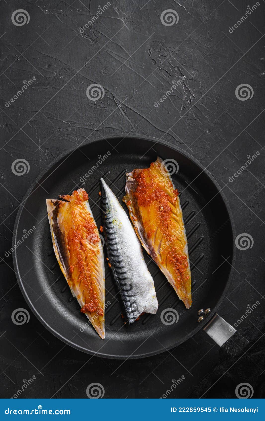 Marinated Mackerel on Grill Pan on Black Background, Top View with Copy