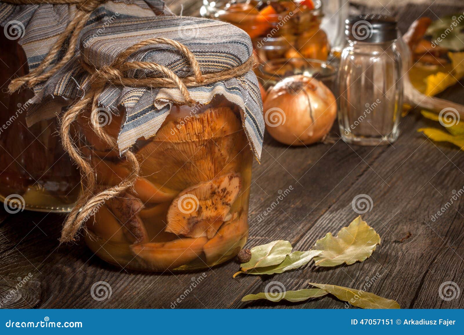 Marinated mushrooms. Delicious marinated mushrooms, oil and spices on wooden table. Selective focus.