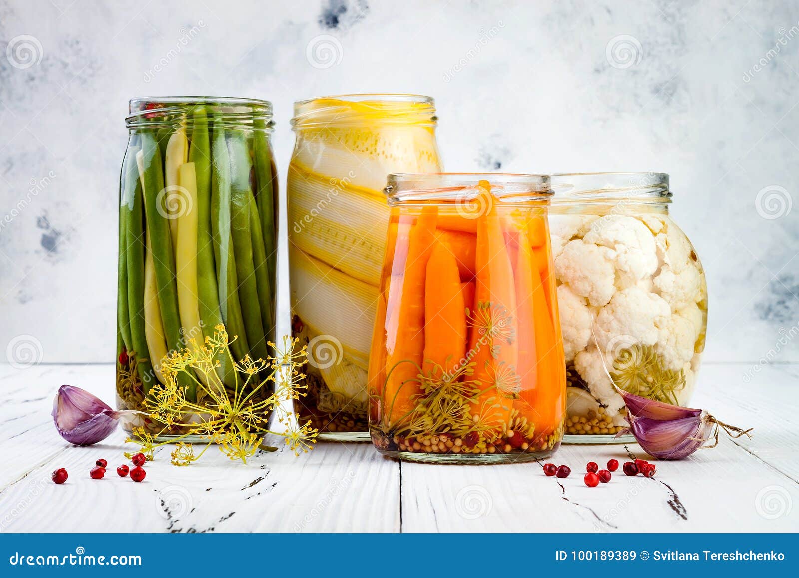 marinated pickles variety preserving jars. homemade green beans, squash, carrots, cauliflower pickles. fermented food