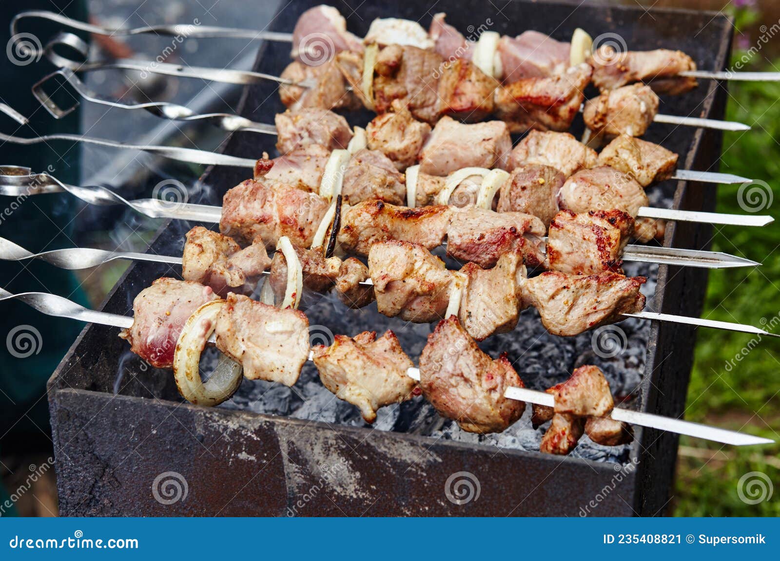Marinated Shashlik Preparing on a Barbecue Grill Over Charcoal Stock ...