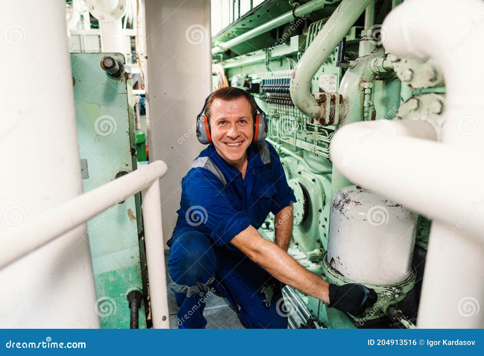 marine engineer officer controlling vessel enginesand propulsion in engine control room ecr
