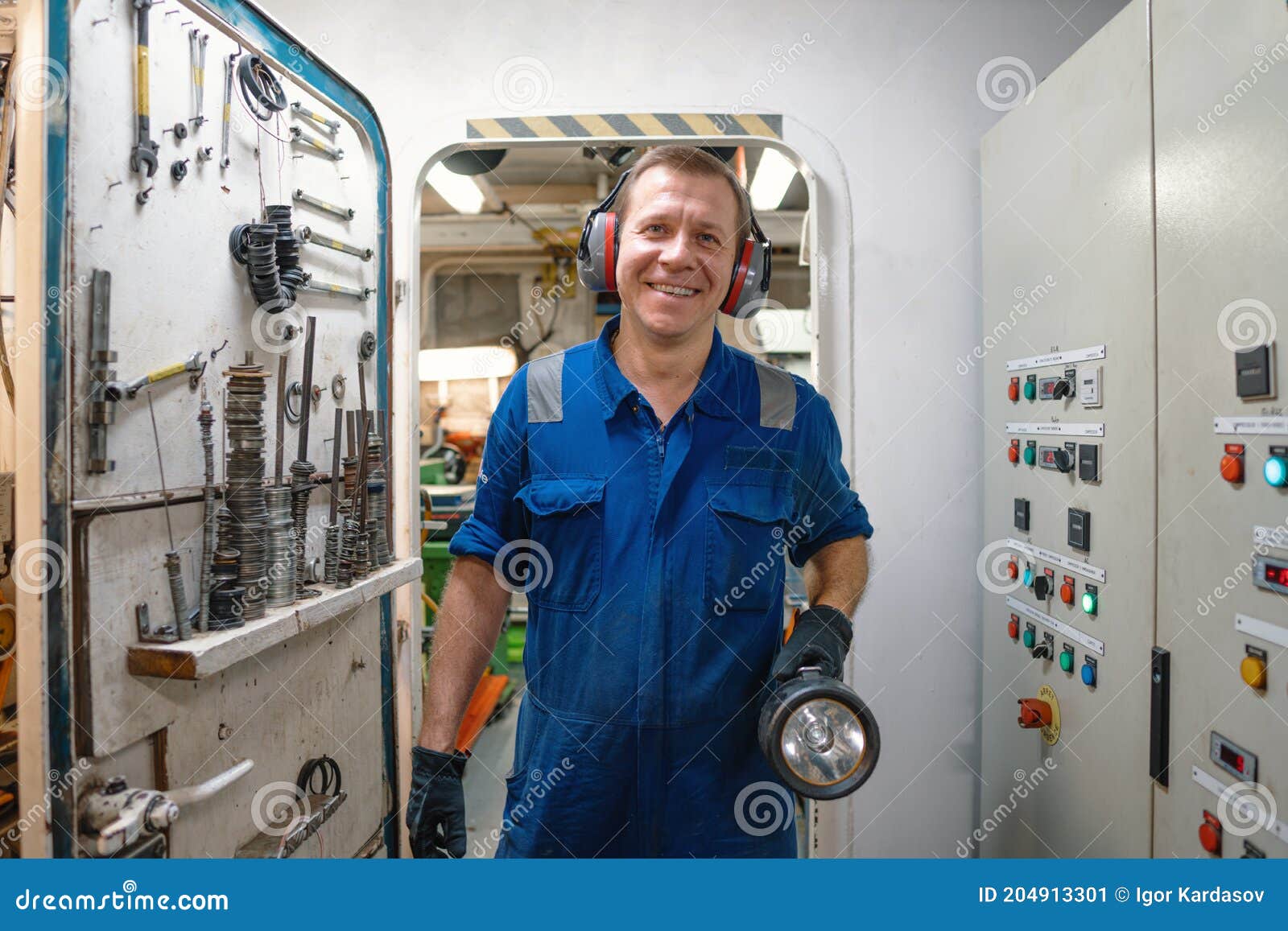 marine engineer officer controlling vessel enginesand propulsion in engine control room ecr