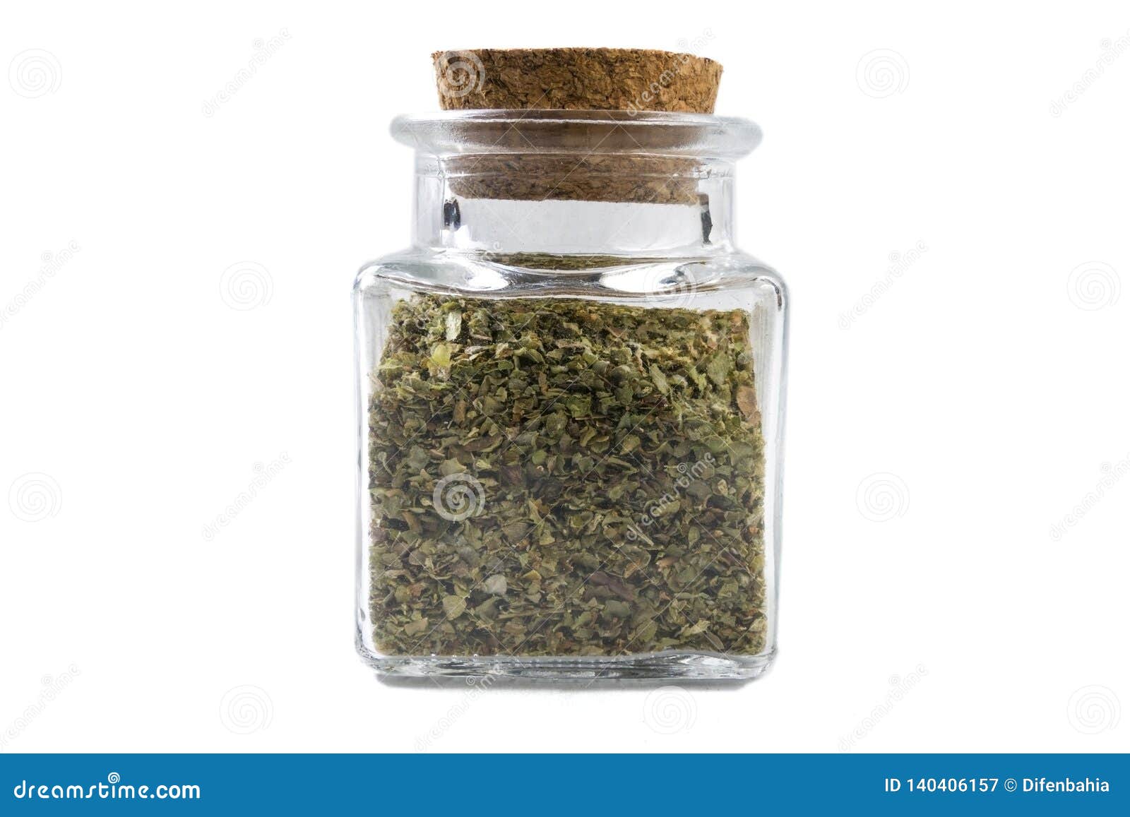 marjoram herb in a glass jar  on white background