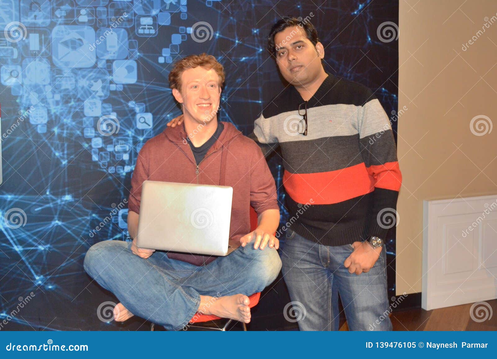 Mark zuckerberg wax statue at madame Tussaud wax museum, San Francisco. Mark zuckerberg wax statue at Madame Tussauds, San Francisco. Mark Elliot Zuckerberg is an American technology entrepreneur and philanthropist. He is known for co-founding and leading Facebook as its chairman and chief executive officer. Fan captured iconic pose along with his idol`s was statue