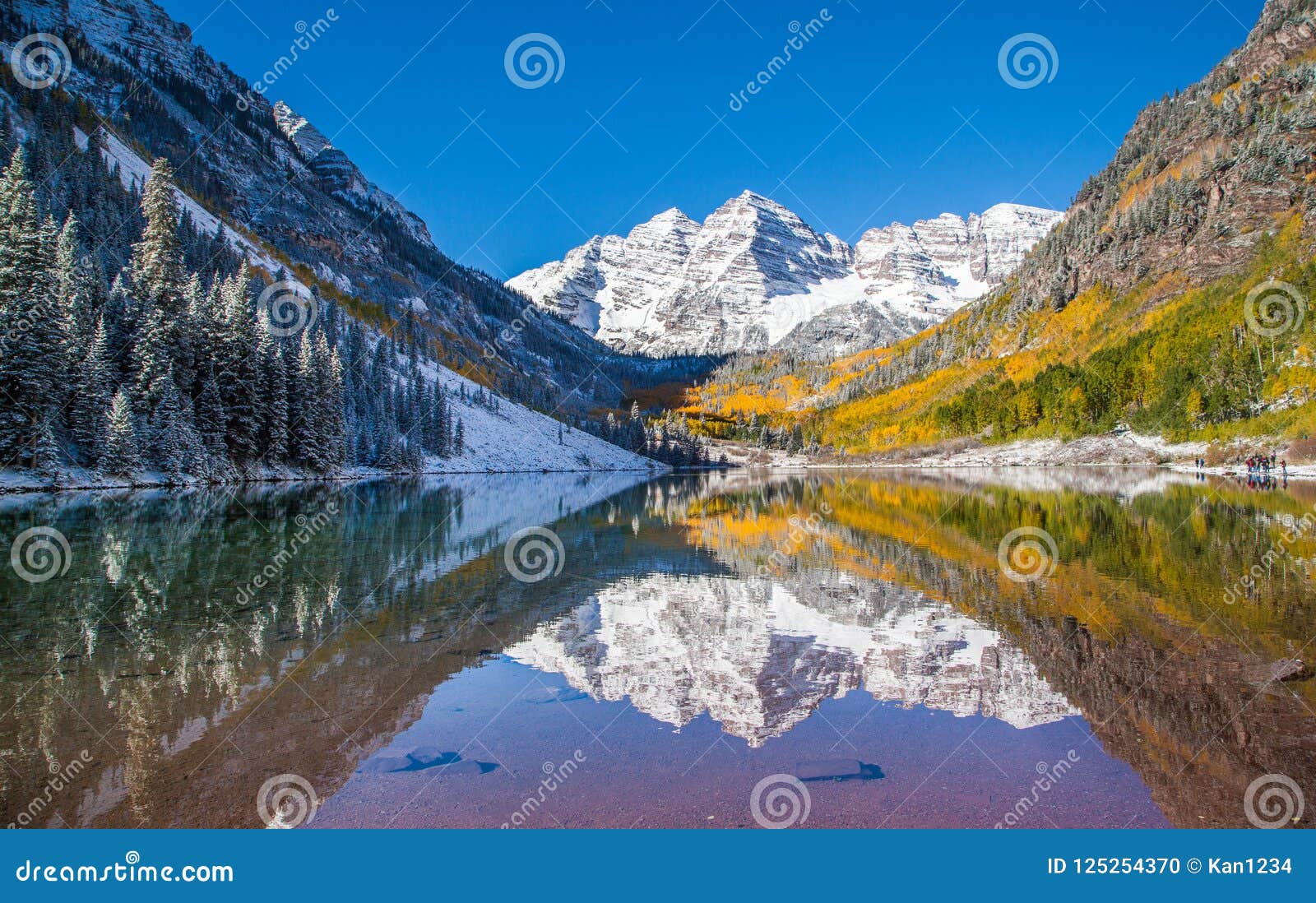 maroon bells in fall foliage after snow storm in aspen, colorado