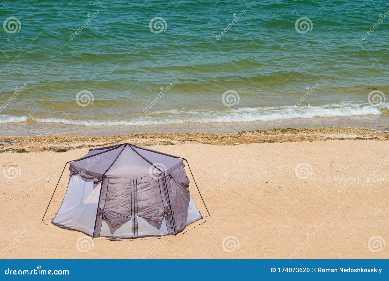 Marquee Tent on the Sea Sandy Coast. Summer Camping on a Beach Stock