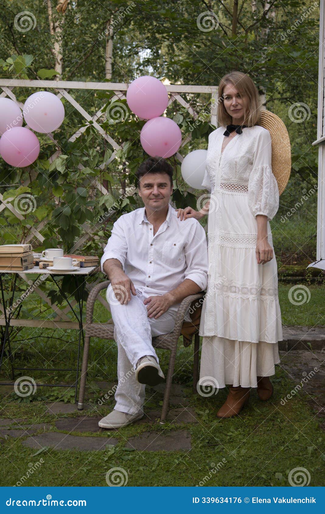 a married couple in boho-style images at a picnic.