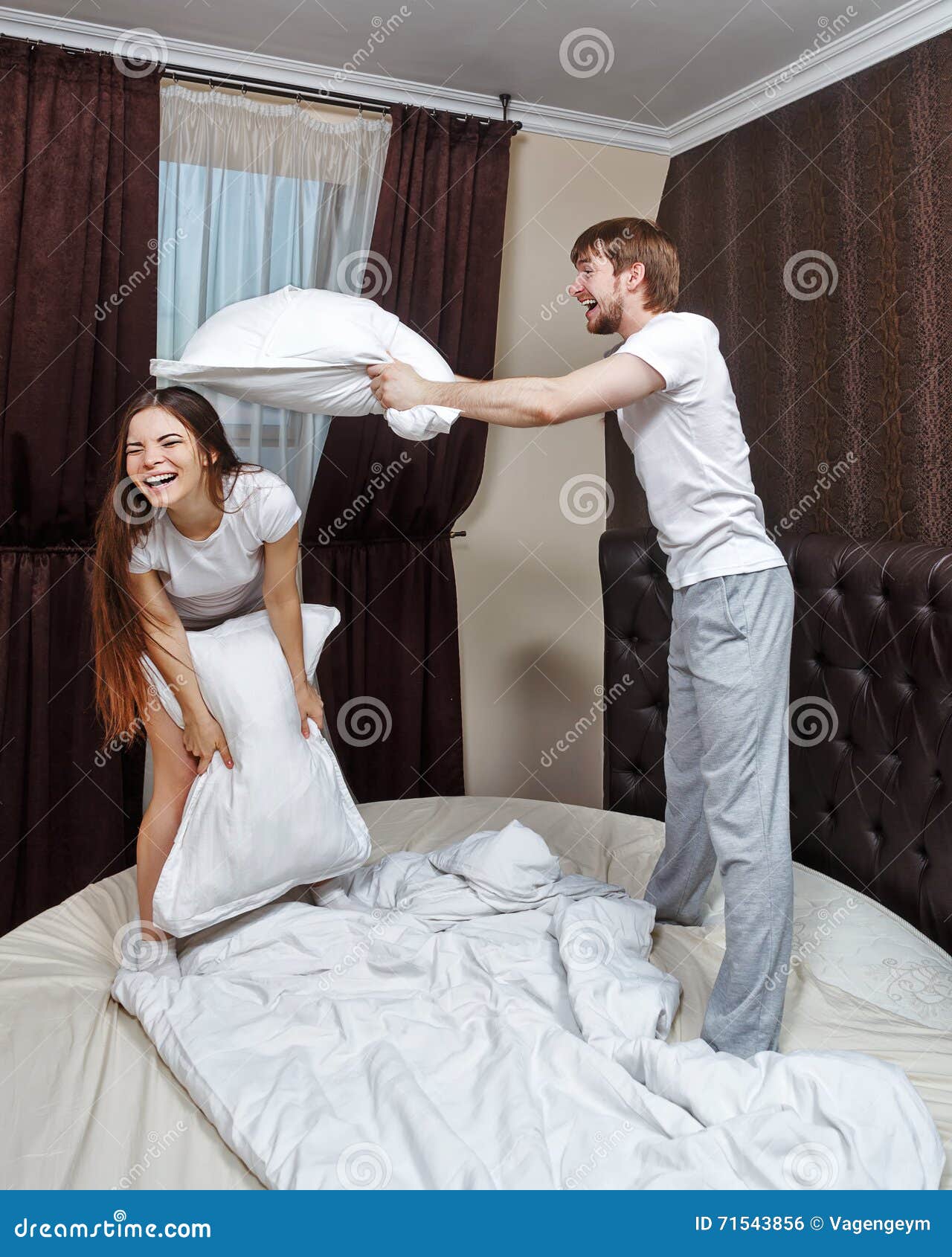 Married Couple Pillow Fight Stock Photo Image Of Home Cheerful