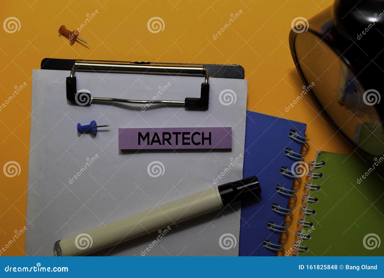 martech write on sticky notes.  on orange table background