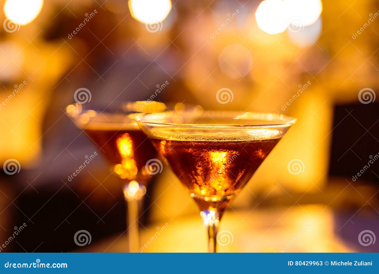 Martini glass on a table stock image. Image of glamour 80429963