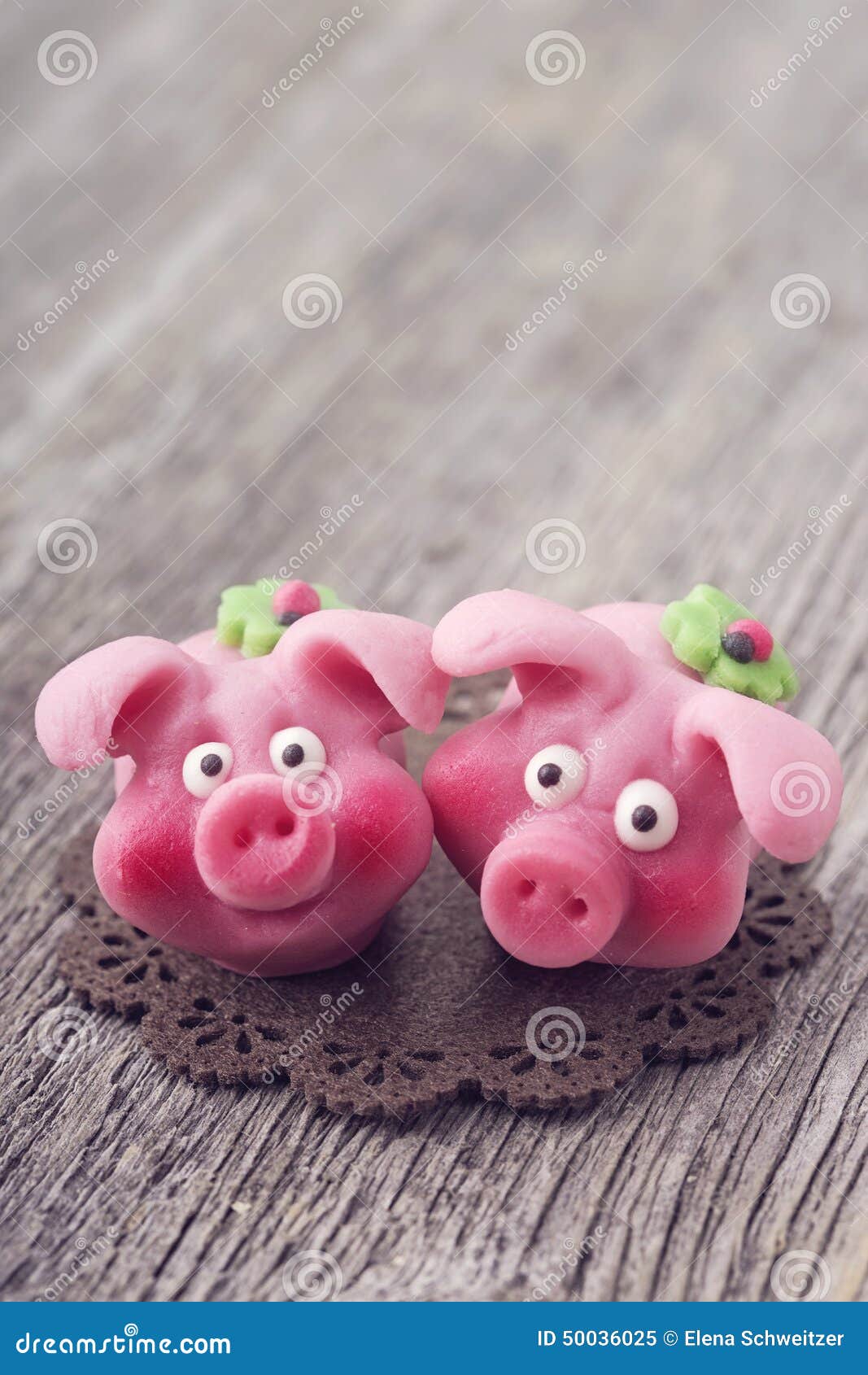 Two Marzipan Pigs With Cloverleaf And Good Luck (in German) Written On