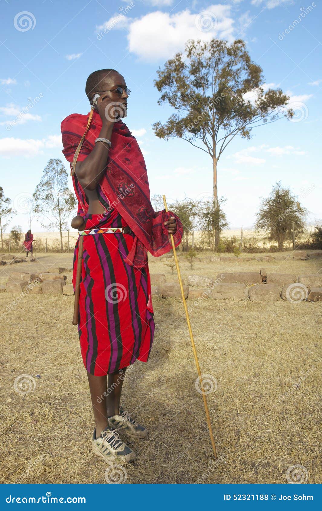 Masai Warrior Using Cell Phone in Village of Nairobi National Park ...