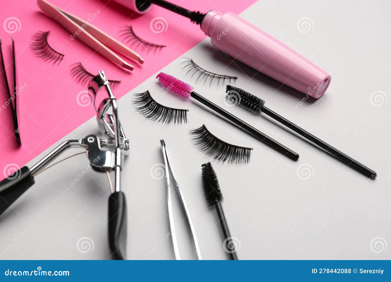 Mascara with False Eyelashes and Tools on Color Background Stock Photo