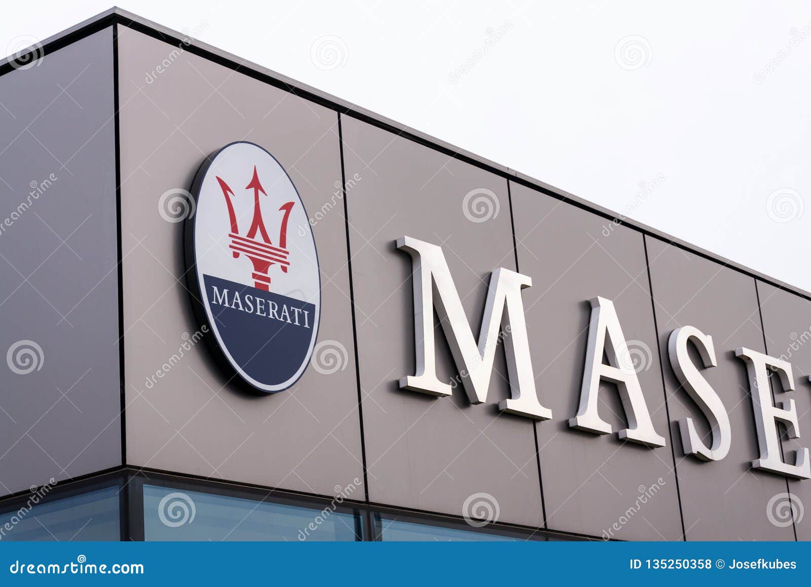 Maserati Italian Luxury Car Manufacturer Company Logo In Front Of