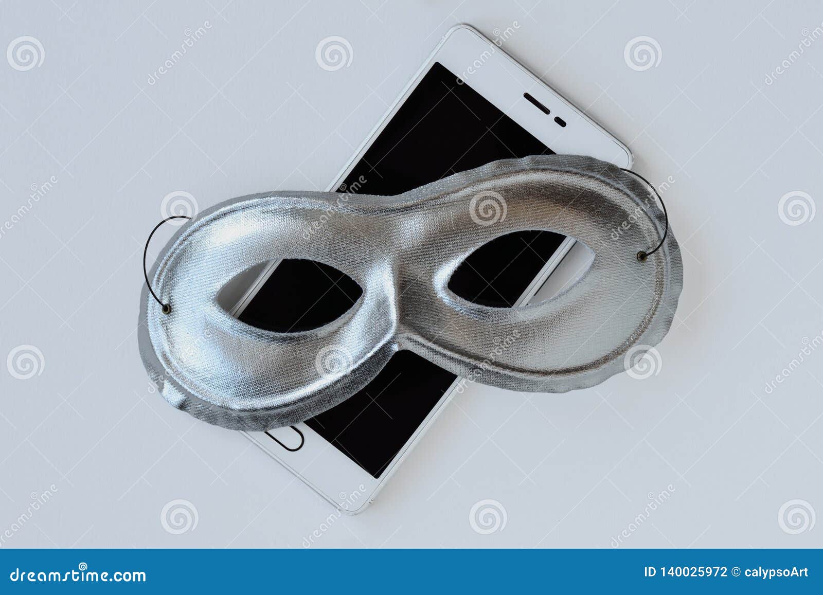mask on mobile phone - concept of privacy, security and anonymity of mobile phones