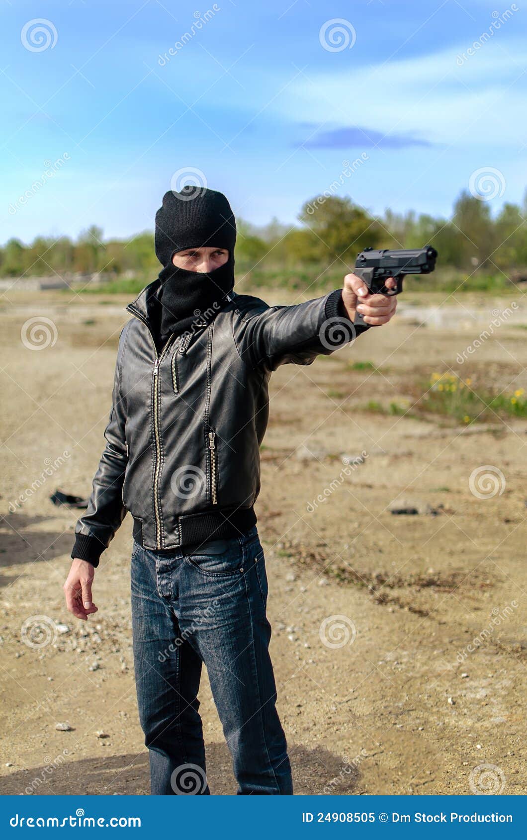 Robbery in store. Robber is aiming and threatening with gun in shop. Stock  Photo