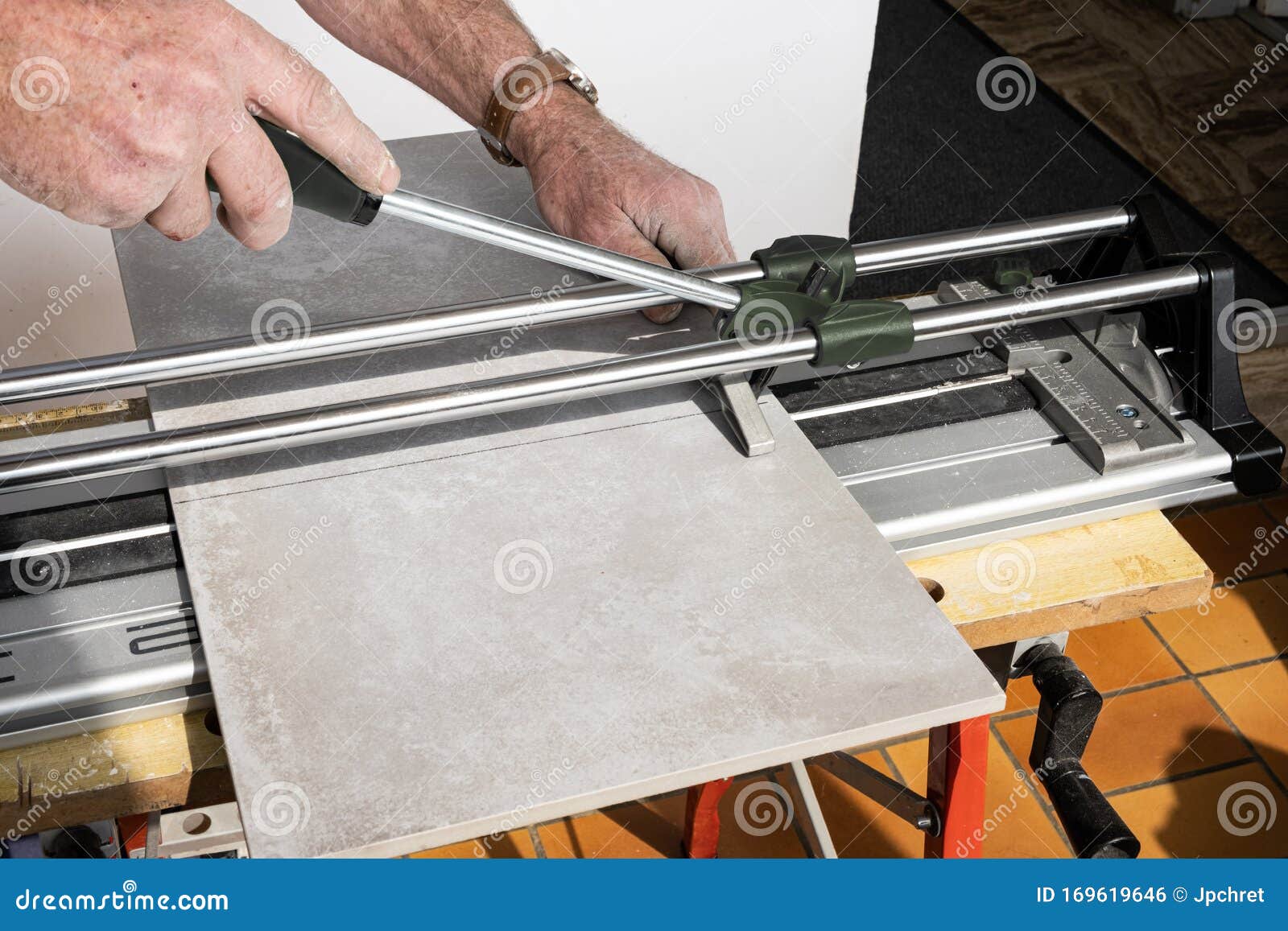 The Mason Cuts a Ceramic Tile with a Tile Cutter Stock Photo Image of