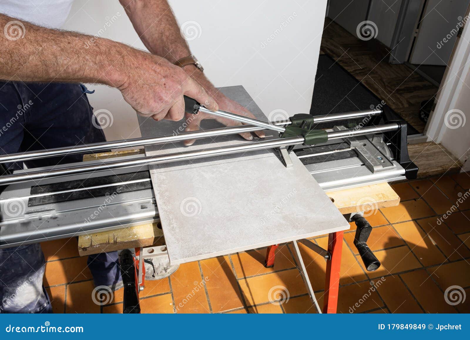 The Mason Cuts a Ceramic Tile with a Tile Cutter Stock Image Image of