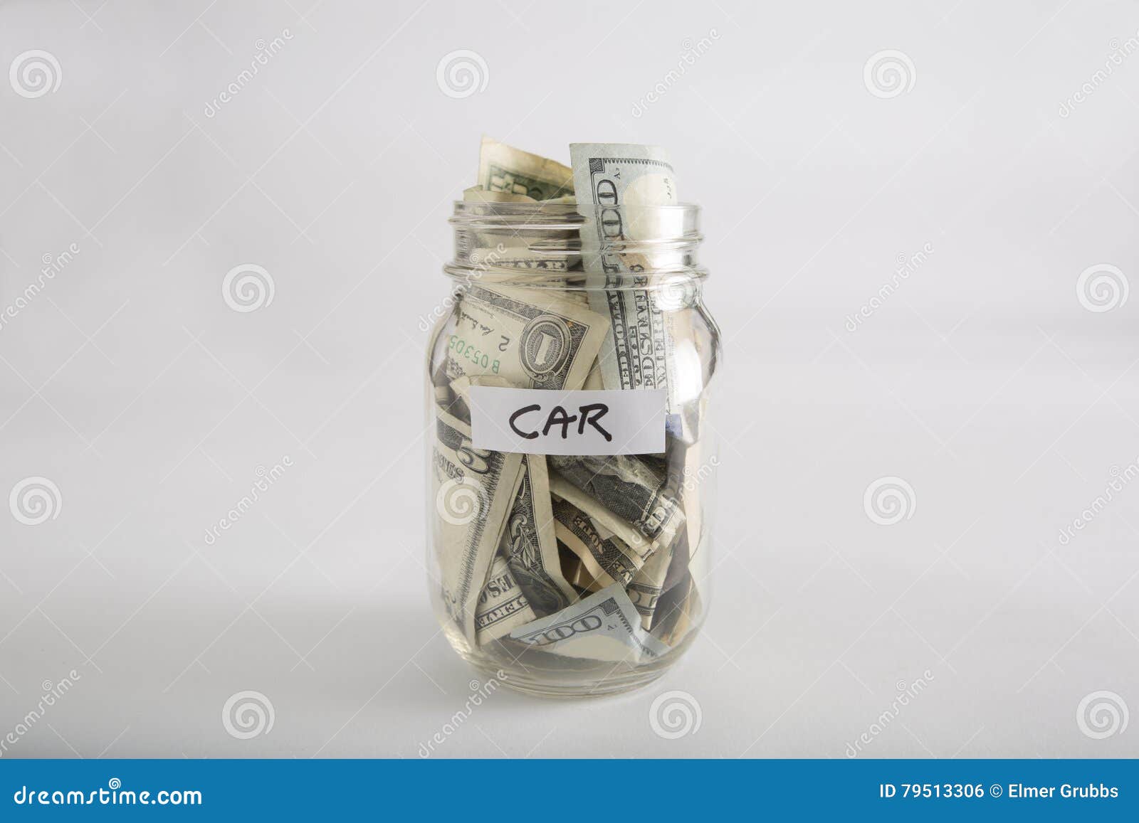 Closeup of Mason jar with money for Car