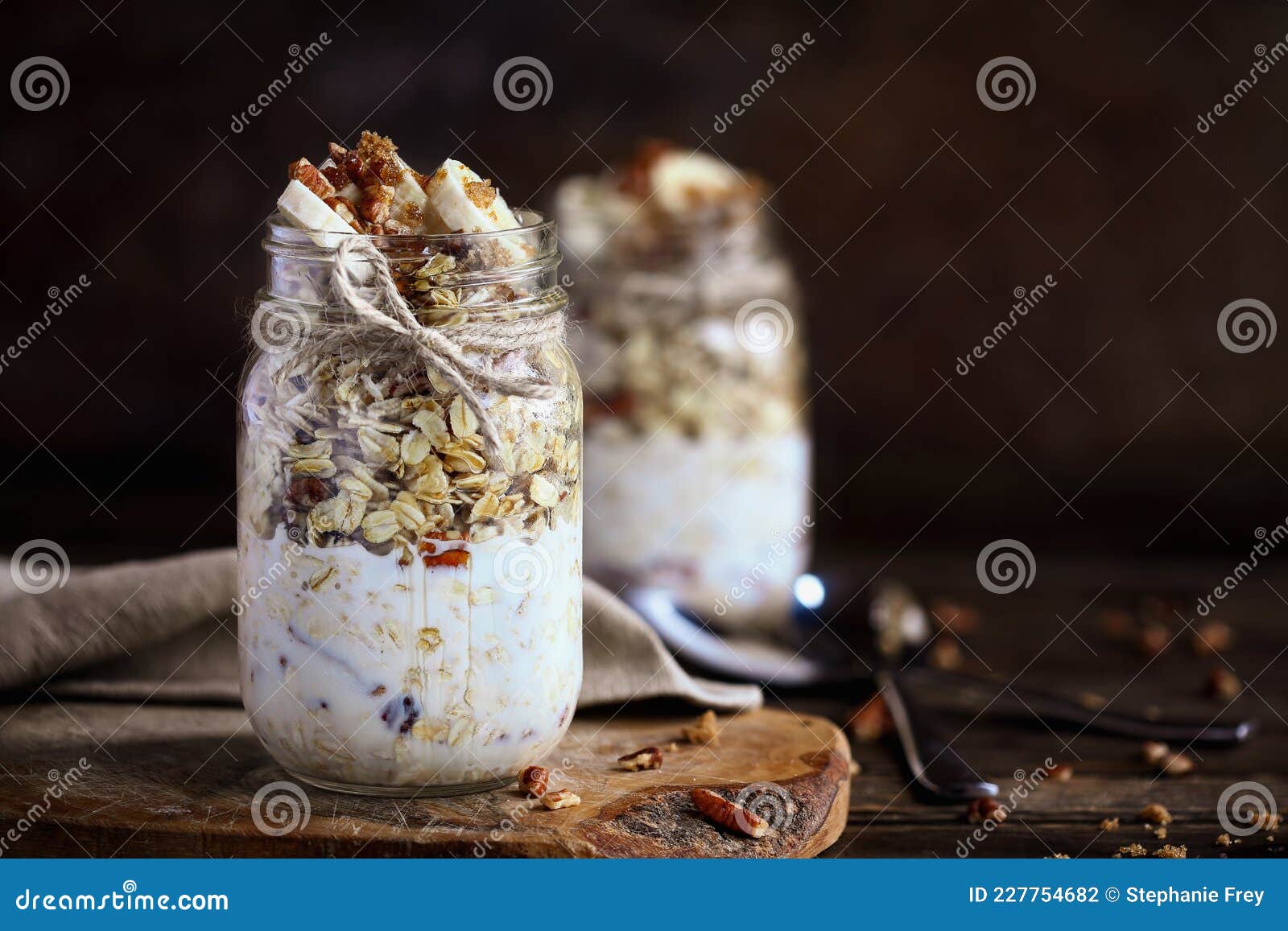 mason jars of overnight oatmeal with bananas and pecan nuts