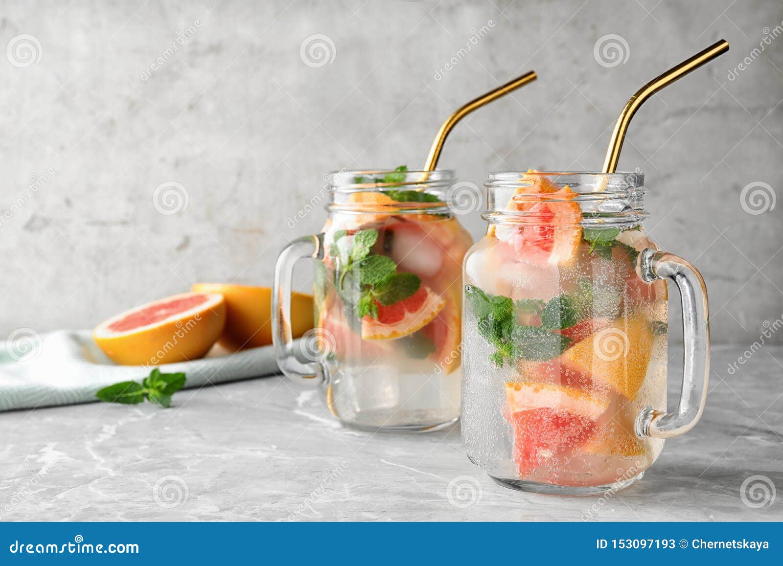 Mason Jars of Refreshing Drink with Grapefruit and Mint on Grey Stone Table Stock Image Image