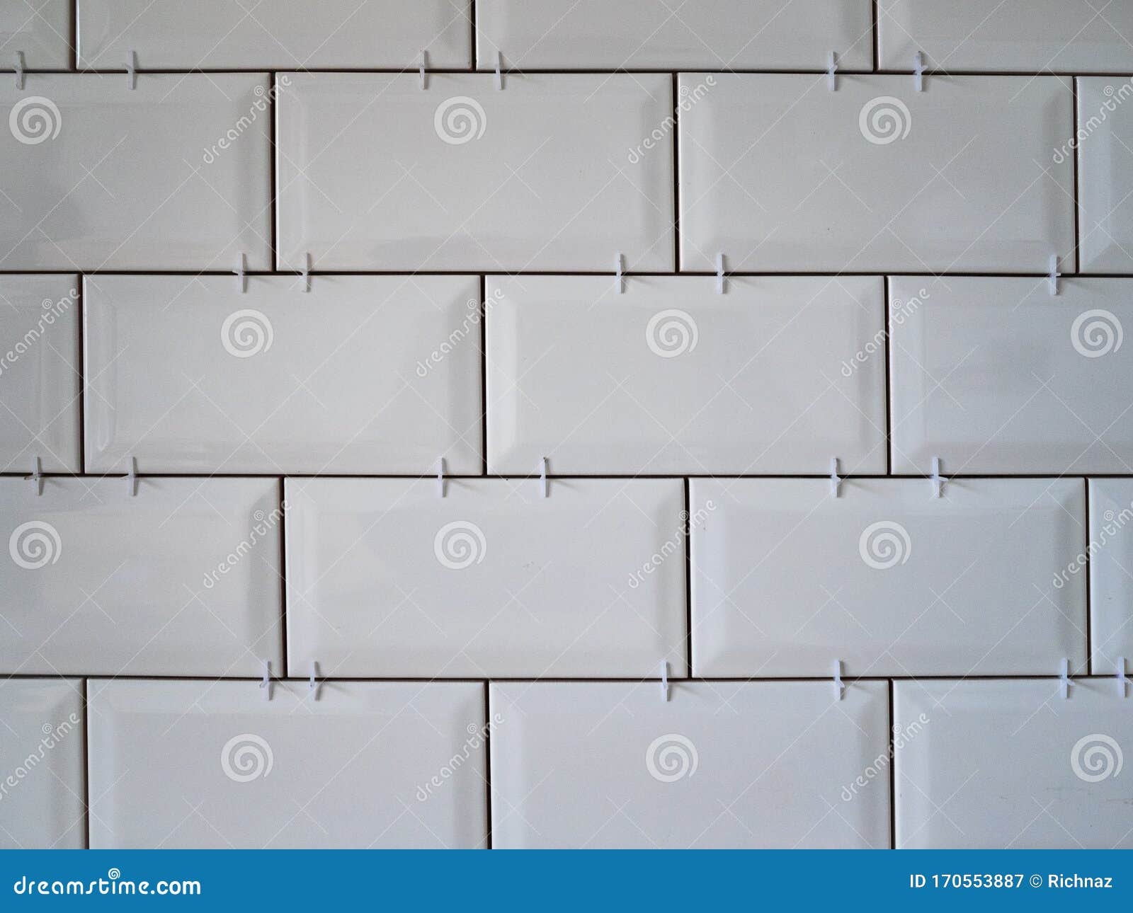 Masonry On The Wall Of White Ceramic Tiles Bathroom Or Kitchen
