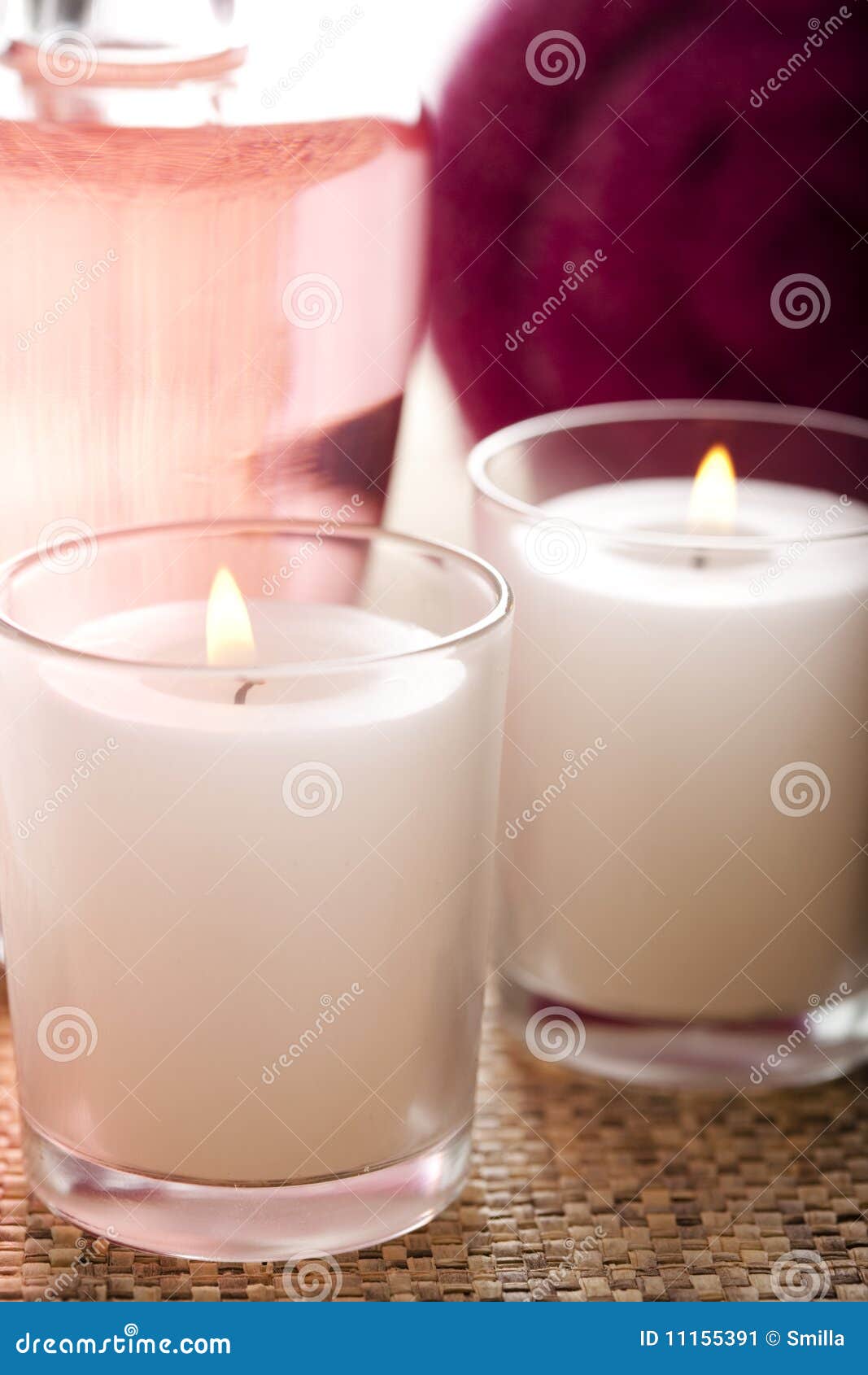 Massage oil and candles stock image. Image of packshot 11155391