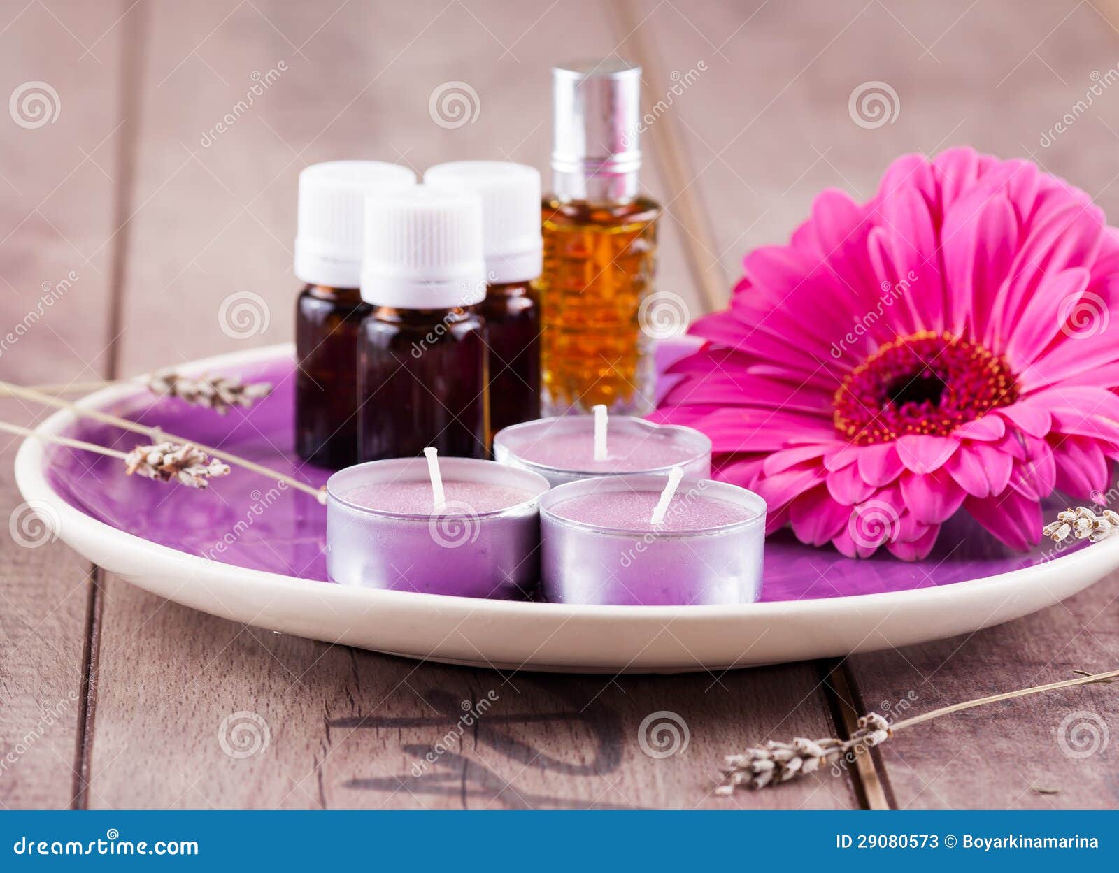 Massage oil with candles stock image. Image of alternative 29080573