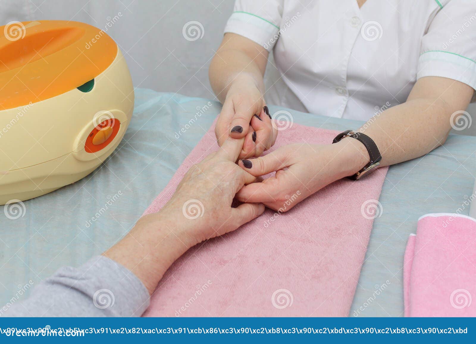 Massage Therapist Doing Massage of Hands, Pressure on Certain Points
