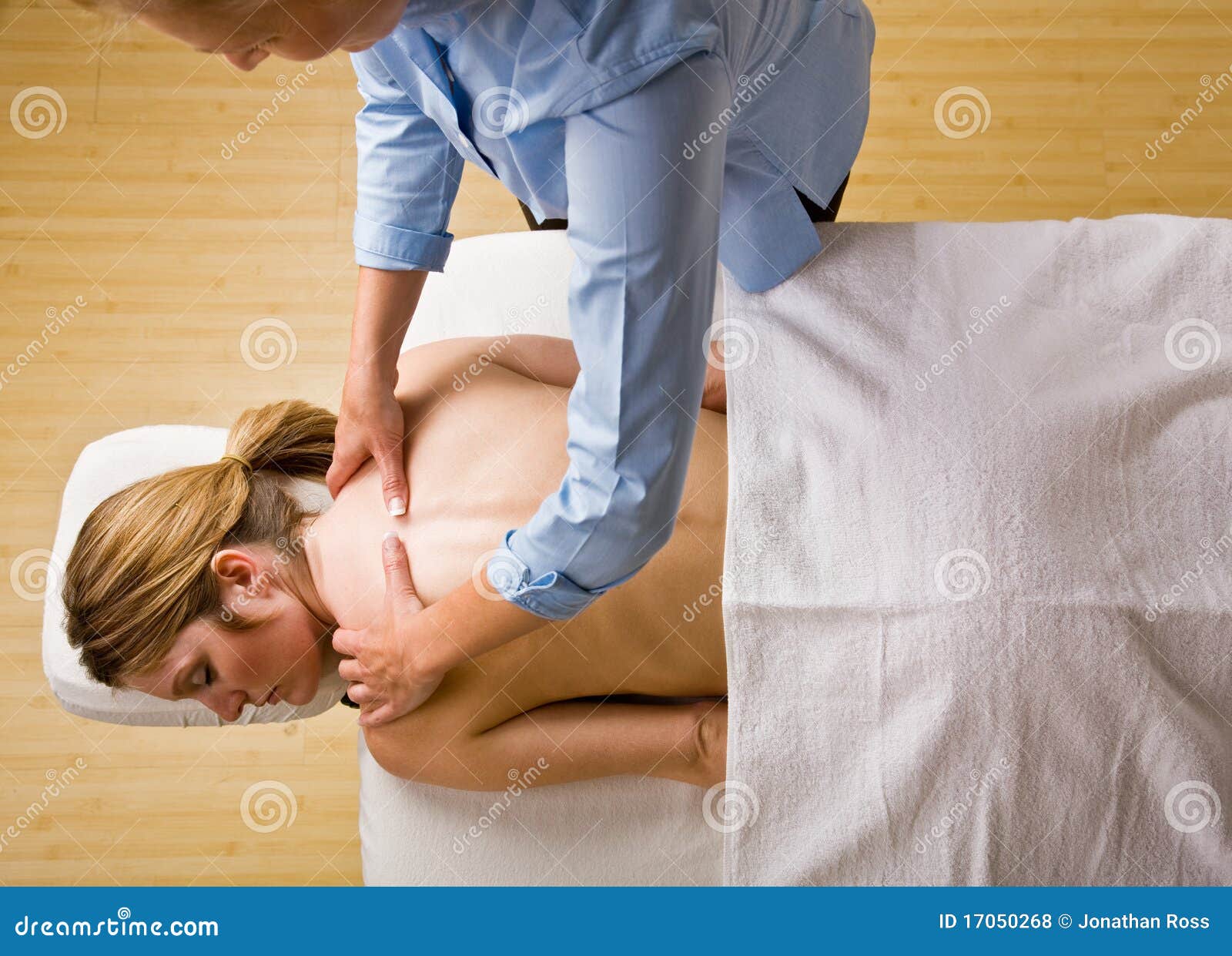 massage therapist giving woman massage