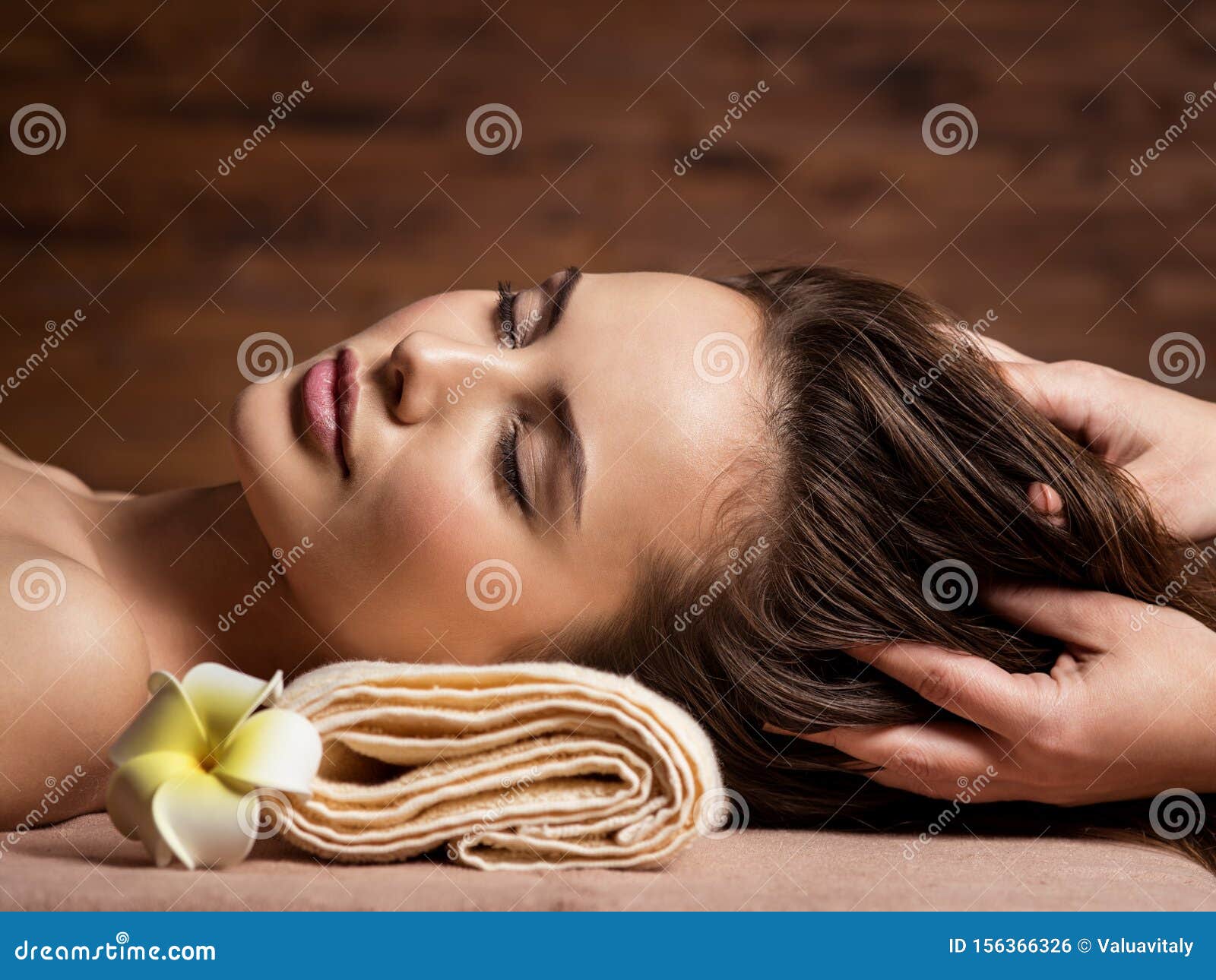 Masseur Doing Massage The Head And Hair For A Woman In Spa Salon Stock