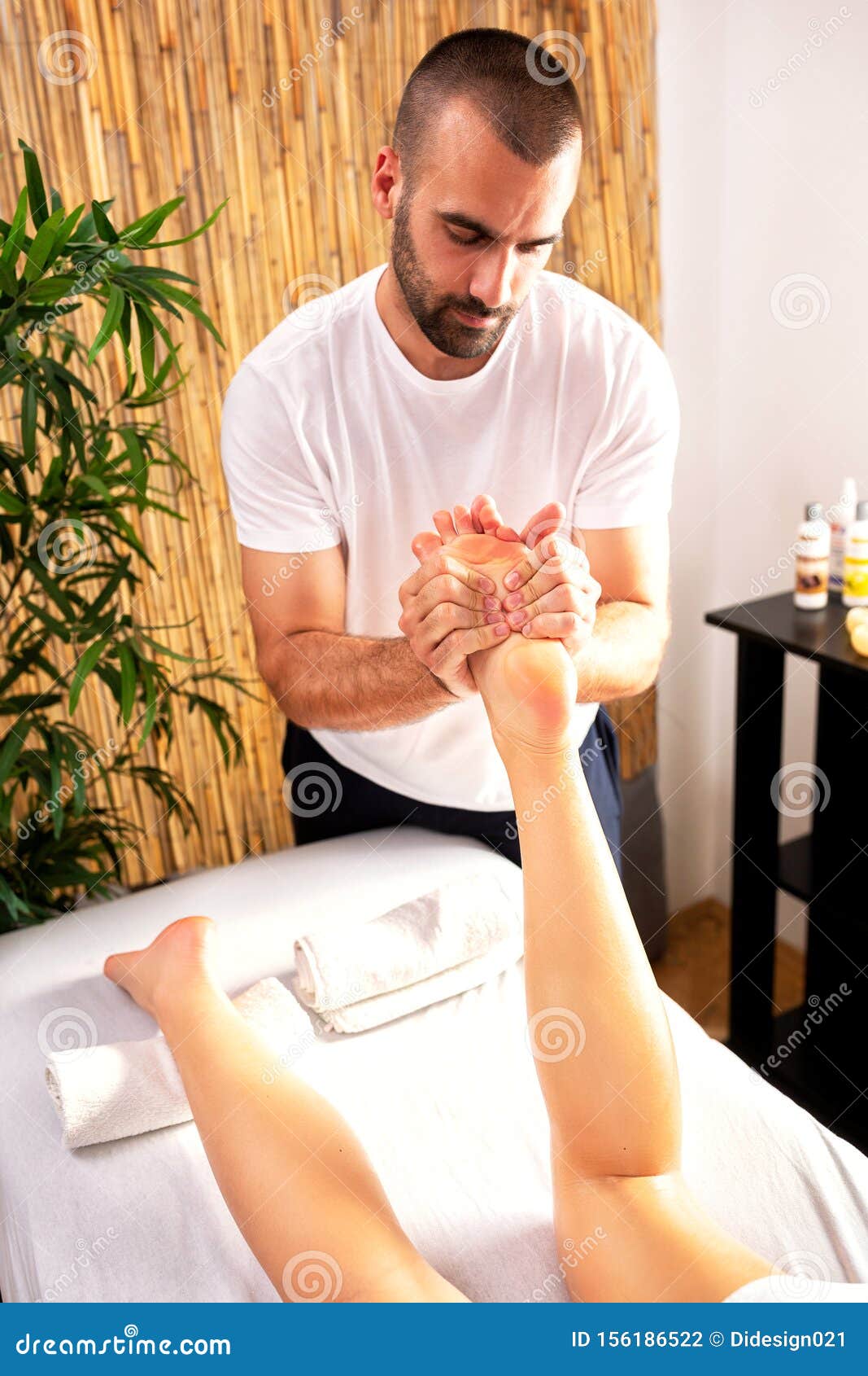 Masseur Helping His Client With