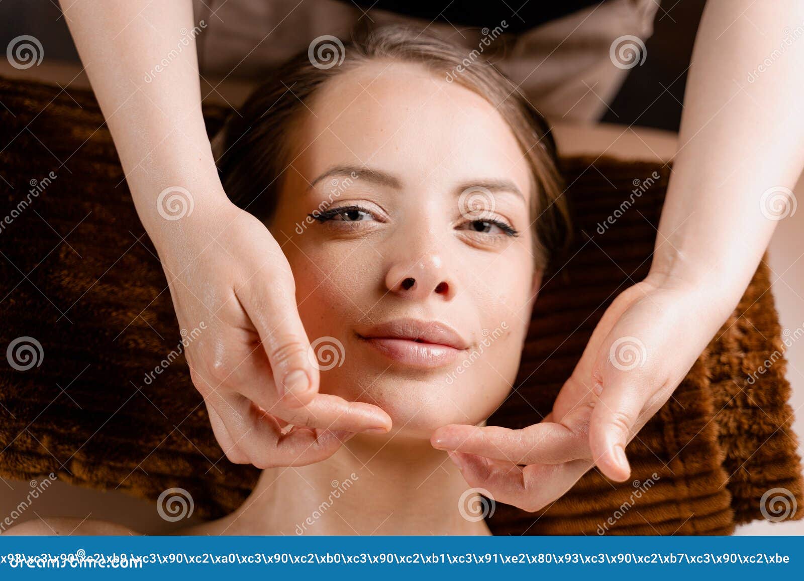 Masseur Is Making Facial Massage In Spa For Model With Perfect Skin Beauty Procedure Stock