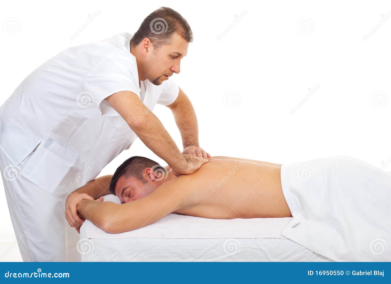masseur massaging man back at spa