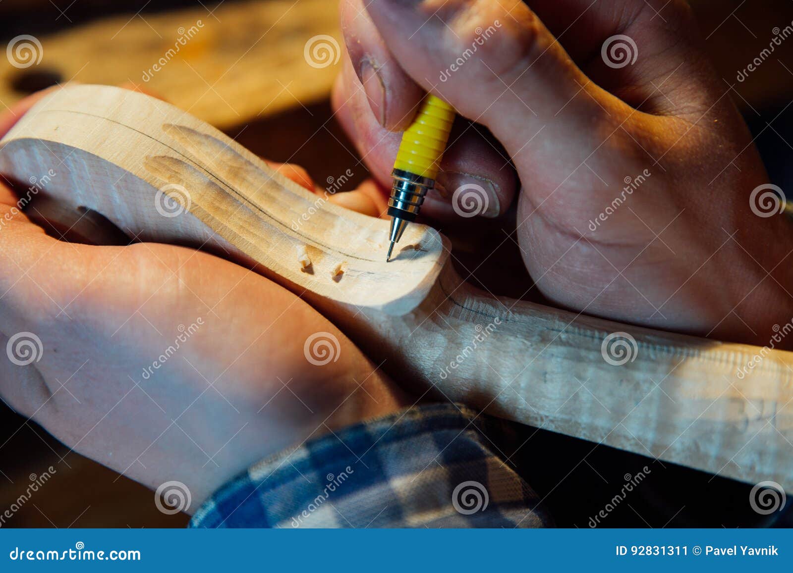 Master Artisan Luthier Working on the Creation of a Violin. Painstaking Detailed Work on Wood