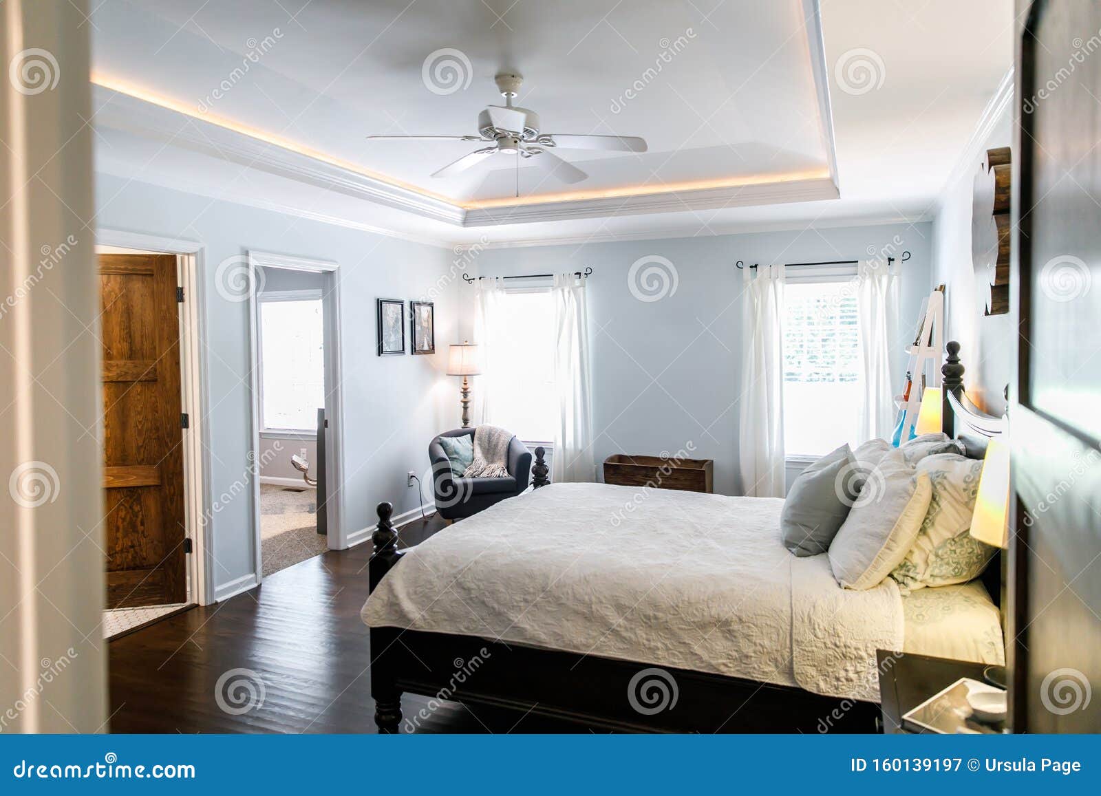 Master Bedroom With King Size Bed And Tray Ceilings With Uplighting And Hradwood Floors Stock Image Image Of Apartment Decor 160139197