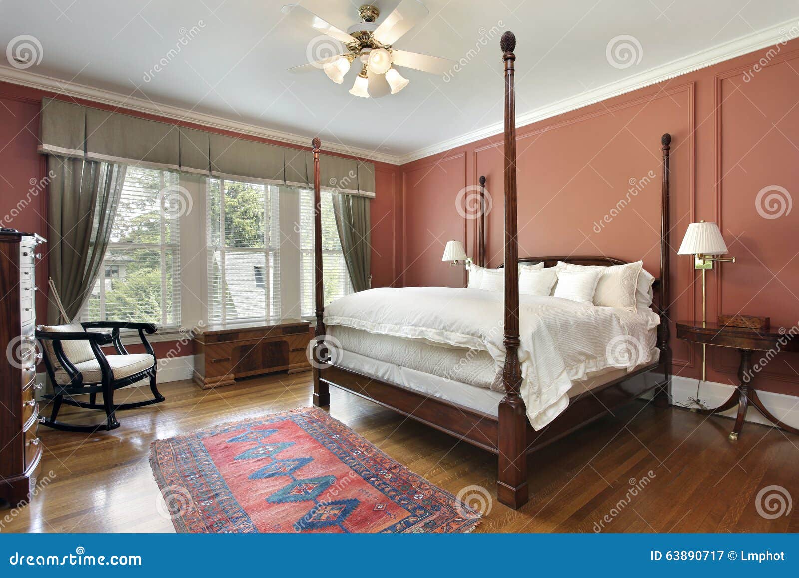 Master Bedroom with Salmon Colored Walls Stock Image Image of table