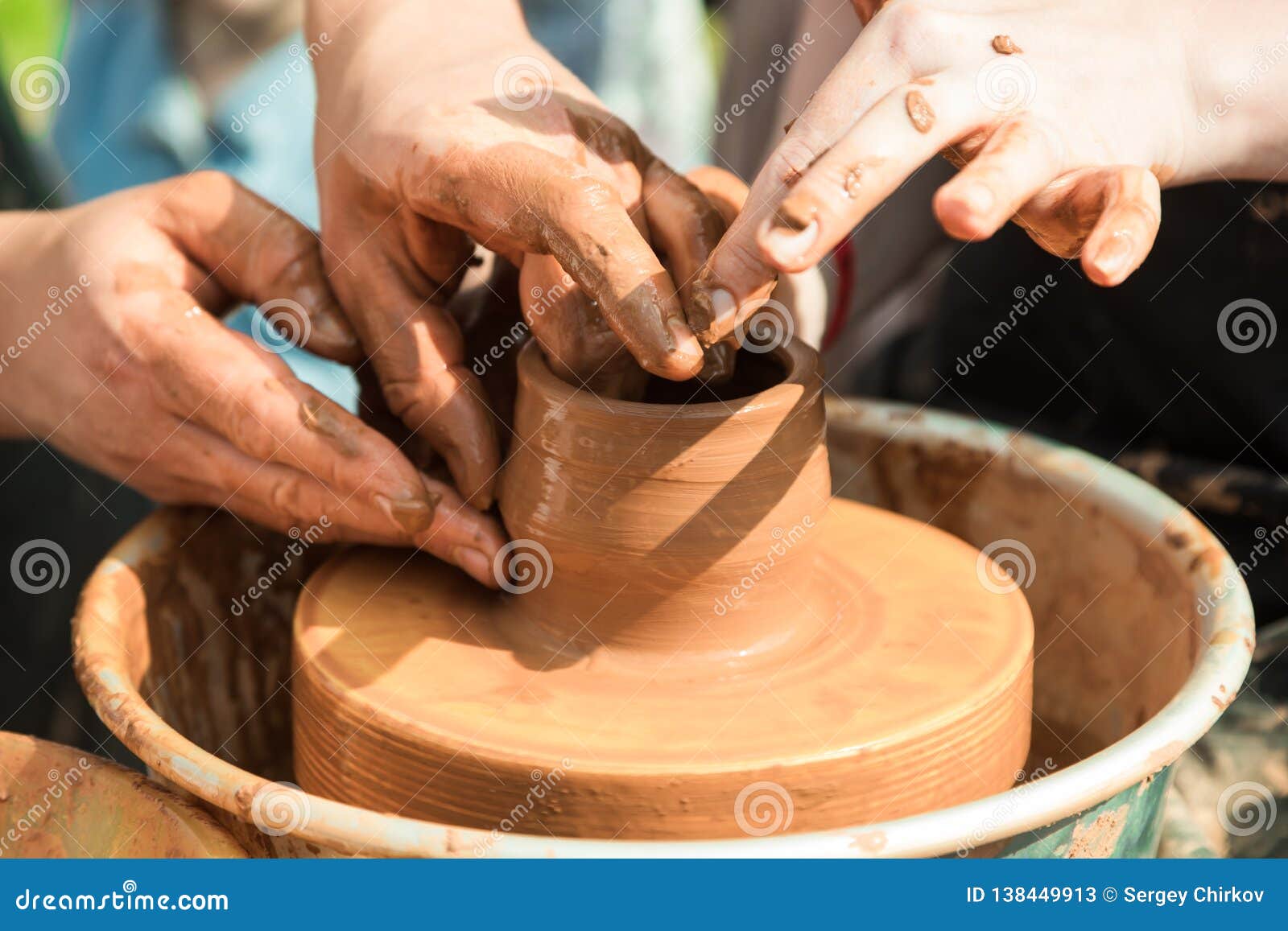 master class on modeling of clay on a potter`s wheel