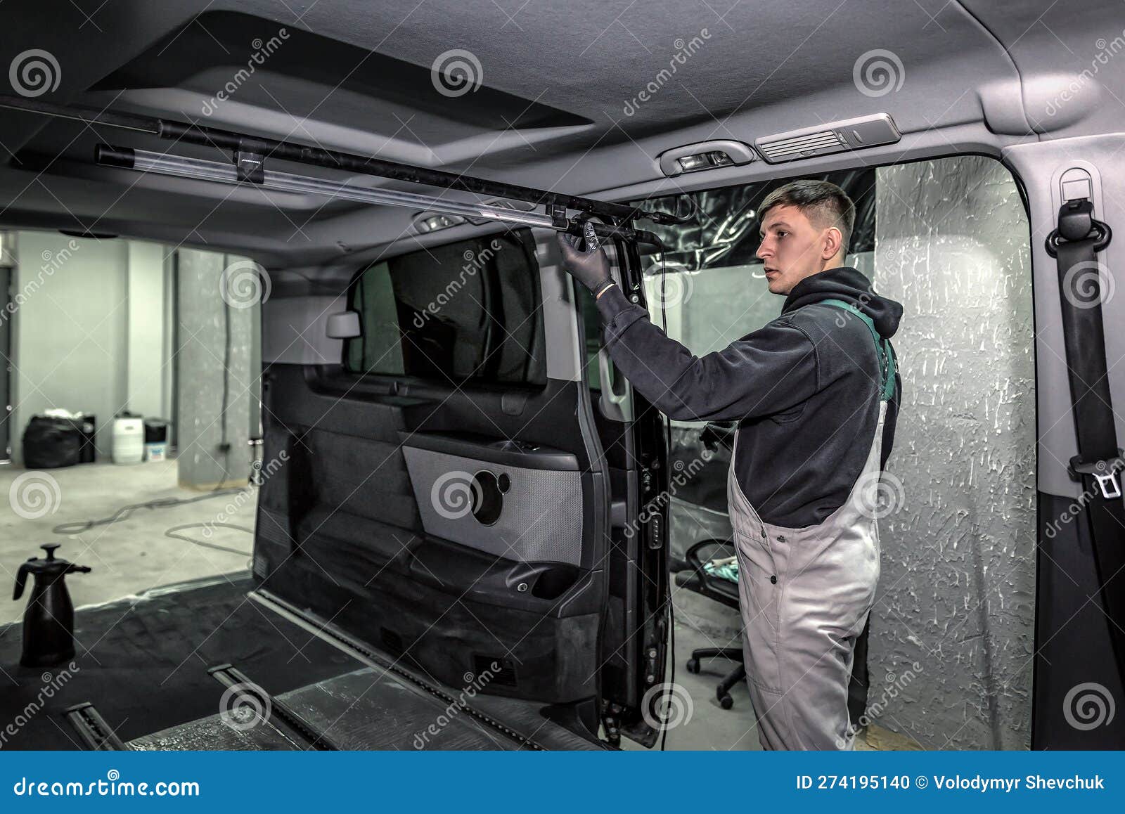 The Master Cleans and Adjusts the Interior of the Car at the Service