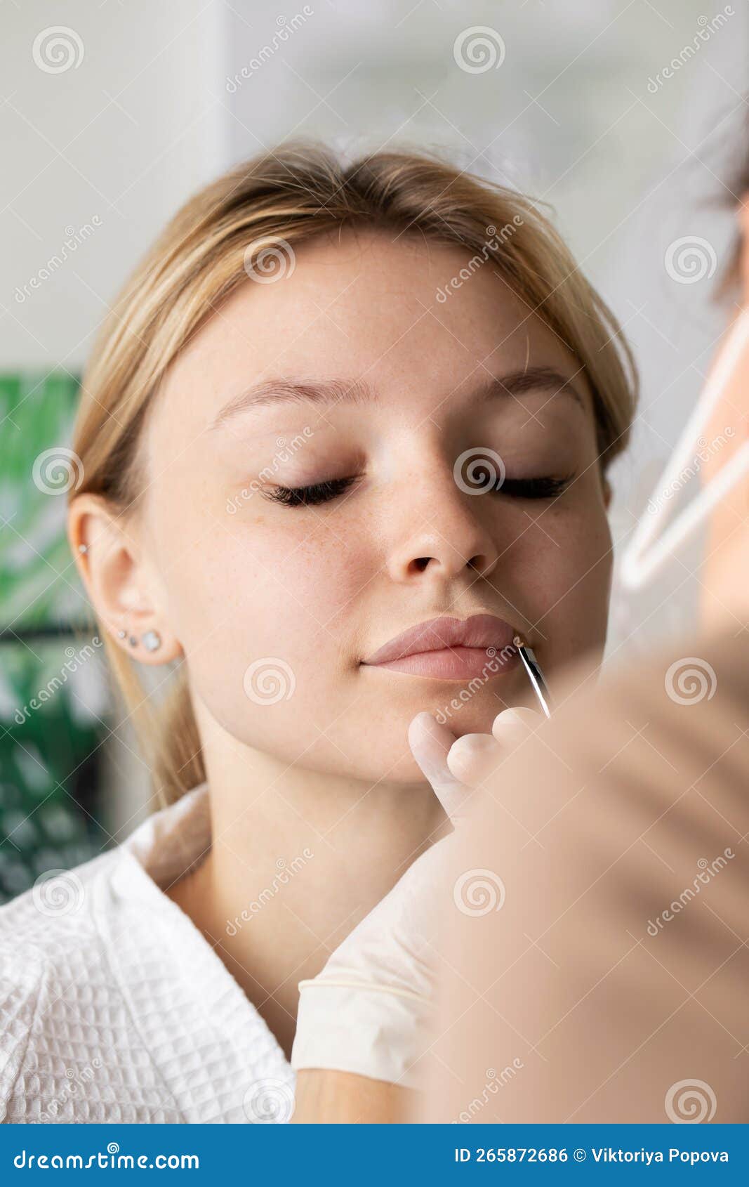 The Master Draws a Sketch before the Lip Permanent Procedure with a