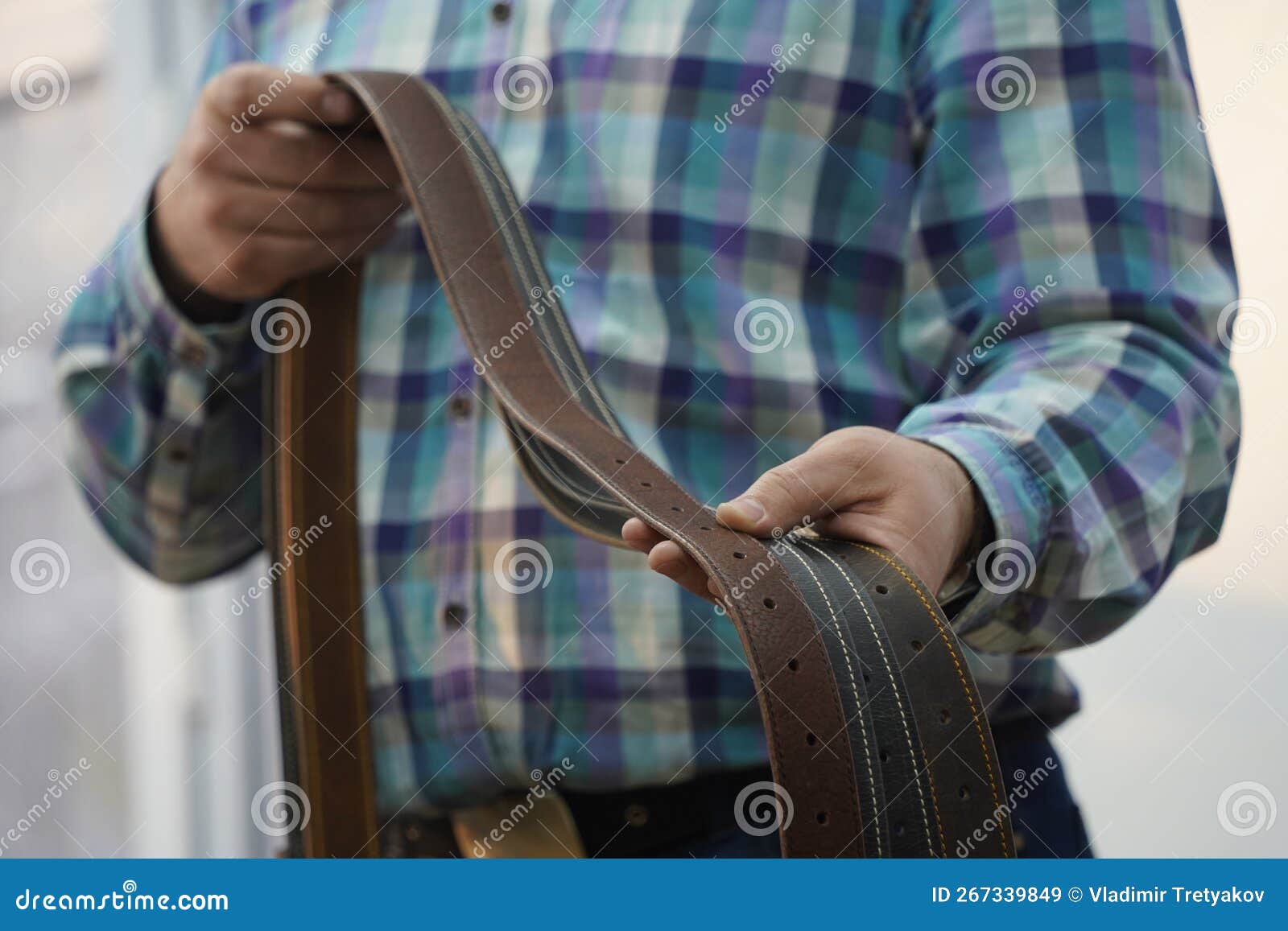 The Master Holds Handmade Leather Belts with Buckles in His Hands Stock ...