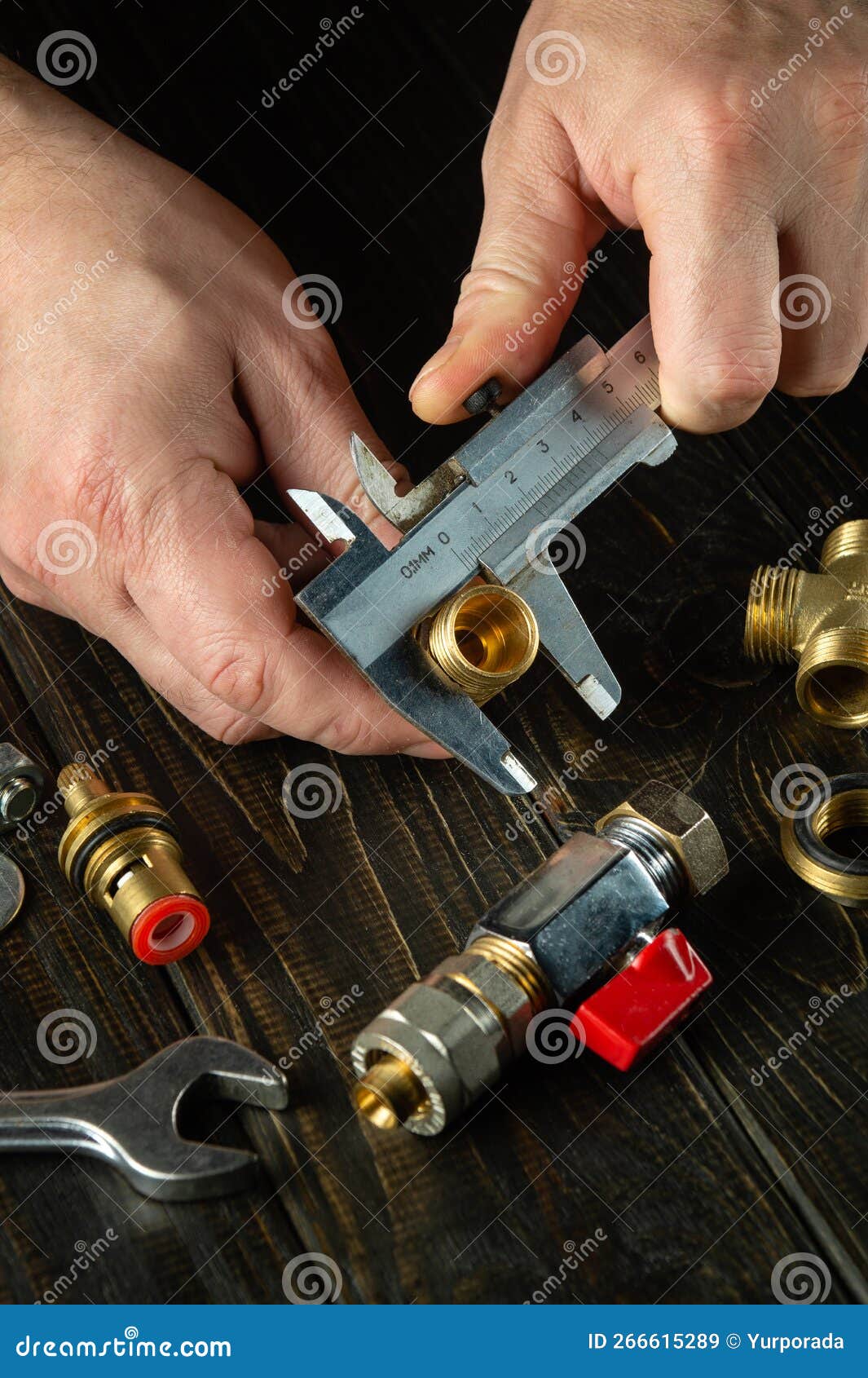 Master Plumber Measures the Diameter of a Fitting with a Caliper