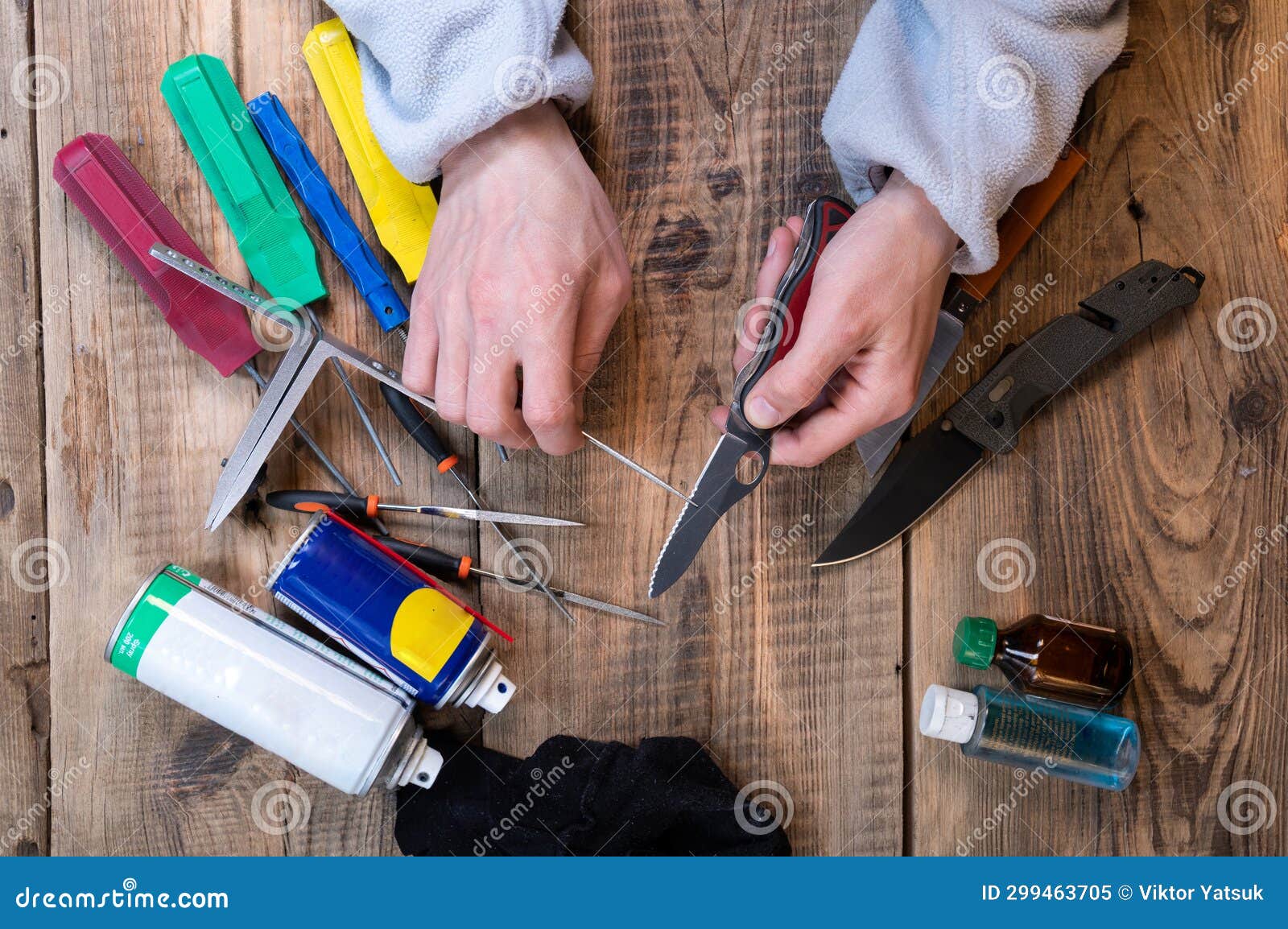 A Master Sharpens a Knife with a Serrated Blade. Sharpening a Serrated