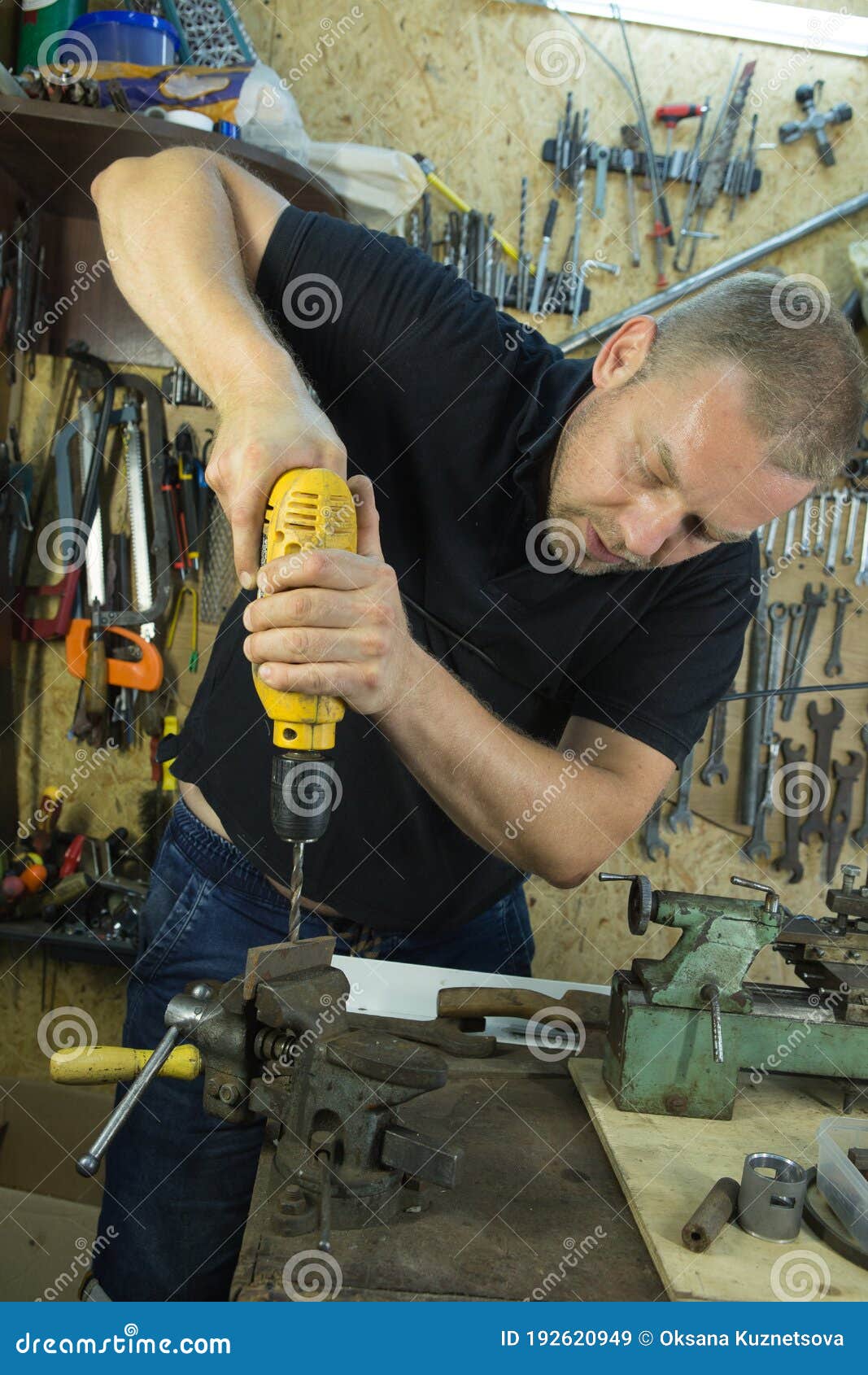 Working with a Vise and Drill. the Master Uses a Drill. Portrait of a